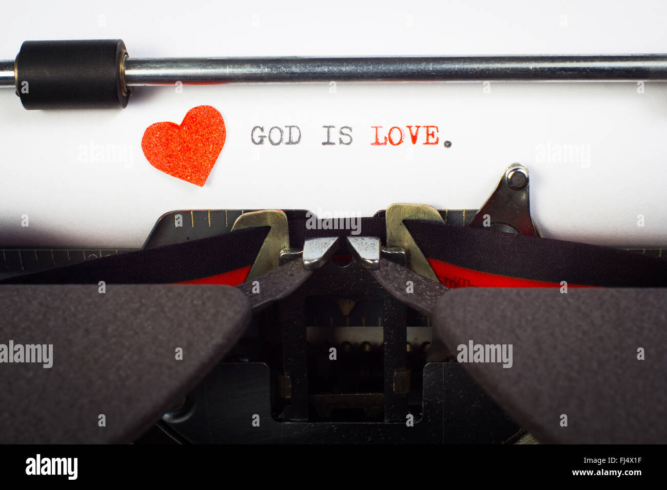 'God is love' written on typewriter Stock Photo