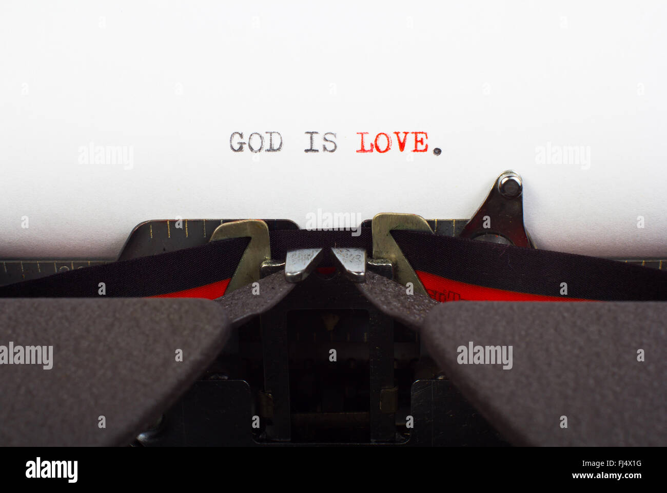 'God is love' written on typewriter Stock Photo