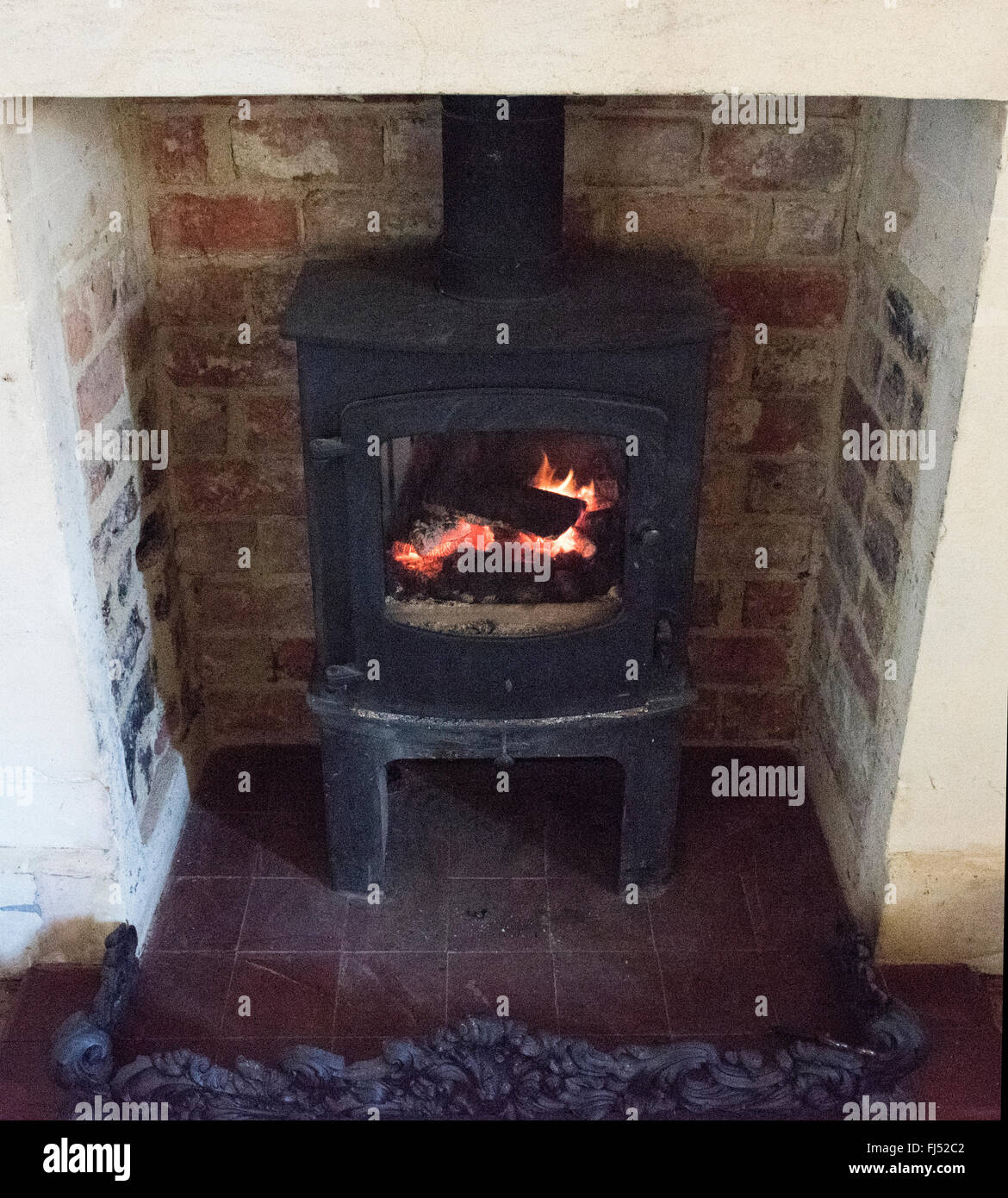 Burning and glowing pieces of wood in Fireplace Stock Photo - Alamy