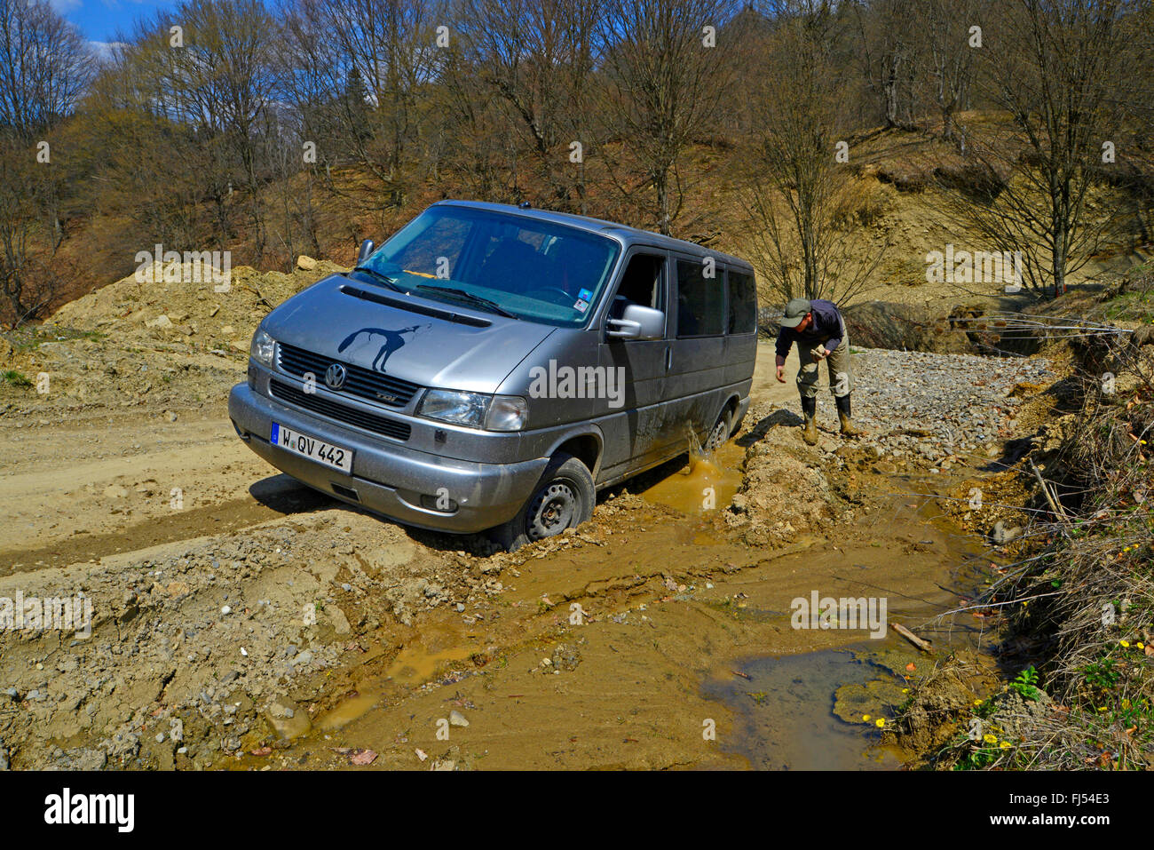 transporter sticks in a mud puddle, Romania, Karpaten Stock Photo