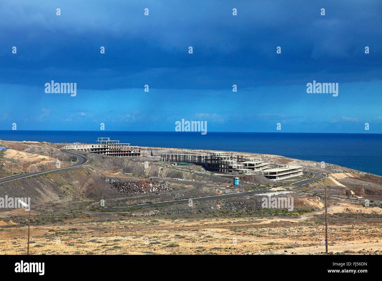 cancelled carcass of a hotel at the coast, Canary Islands, Fuerteventura Stock Photo