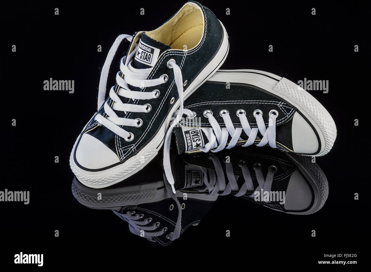 black converse shoes on a black background FJ5E2G