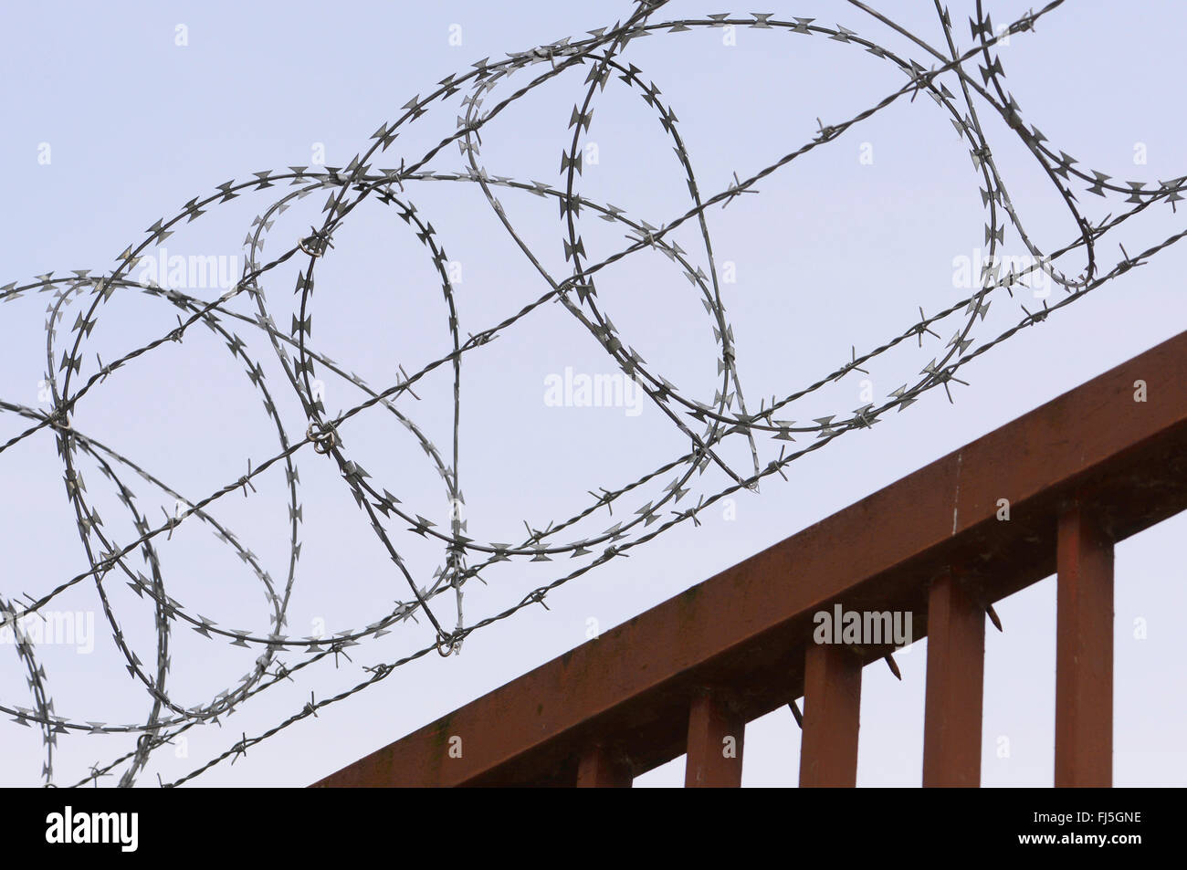 concertina wire, barbed wire on a rusty fence, Germany, Wuppertal Stock Photo Alamy