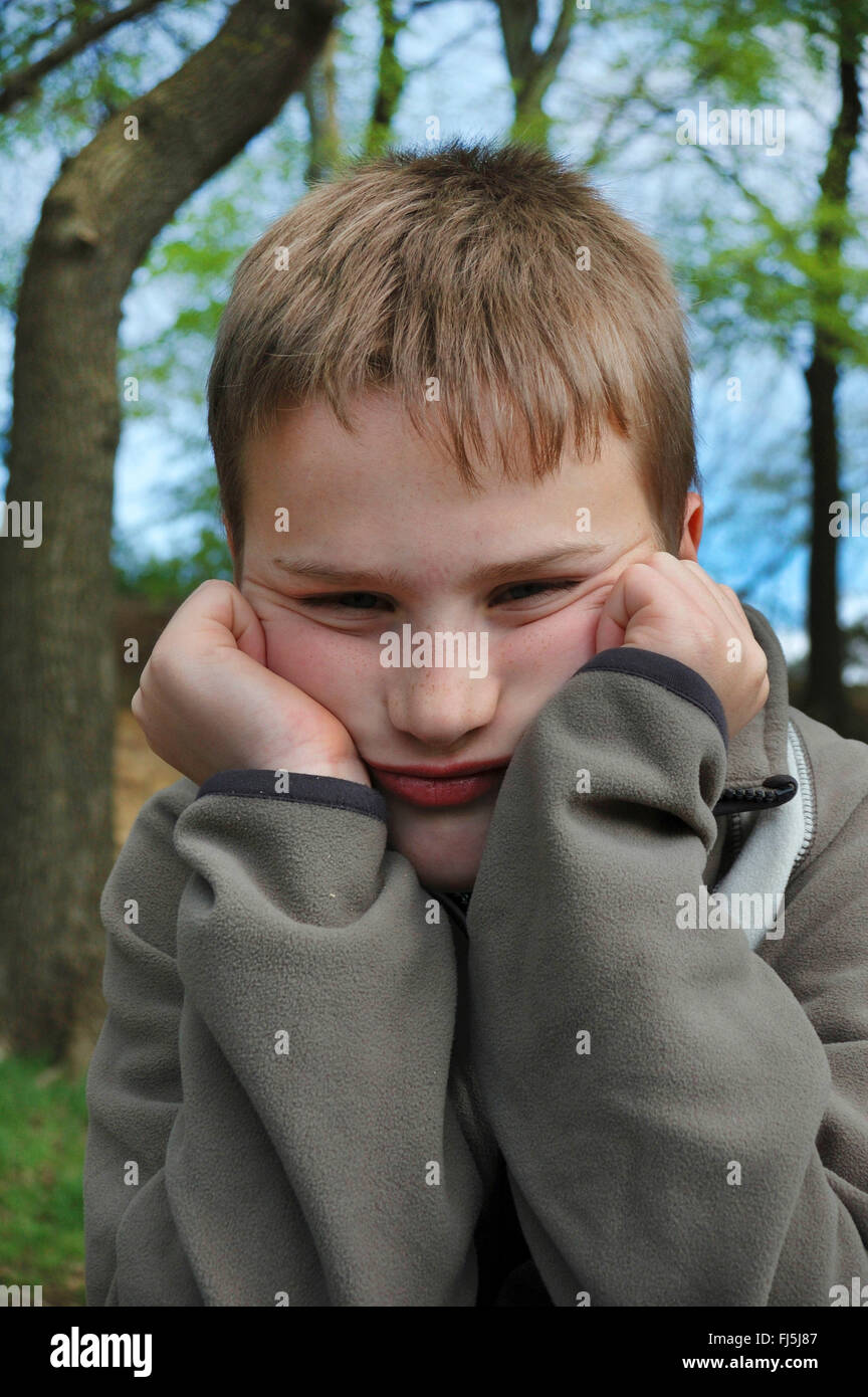 grumpy boy, portrait of a child, Germany Stock Photo