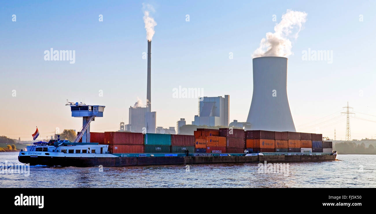 container ship on Rhine, Walsum power plant in background, Germany, North Rhine-Westphalia, Ruhr Area, Duisburg Stock Photo