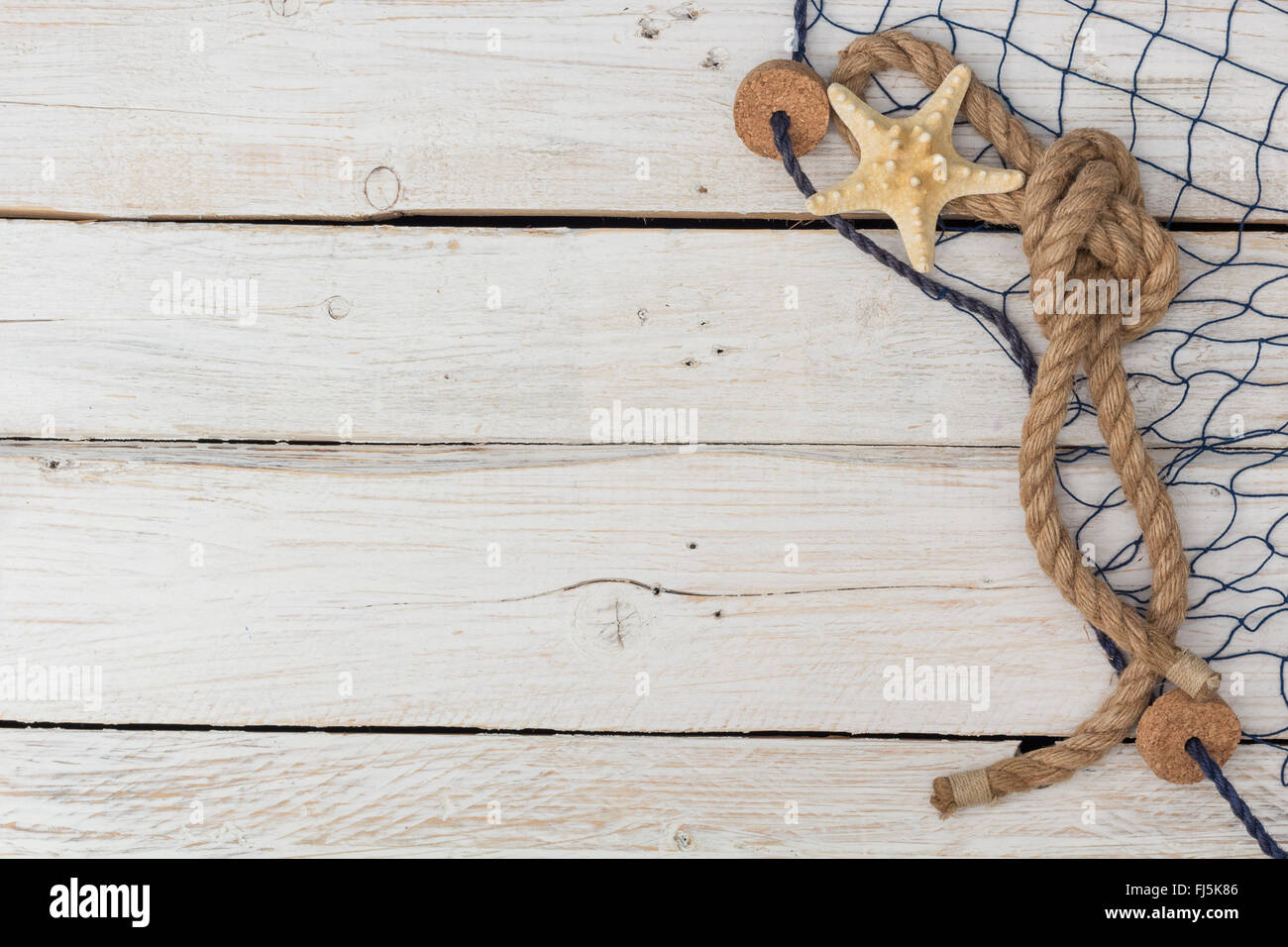 starfish, marine network and rope on the old board, view from above ...