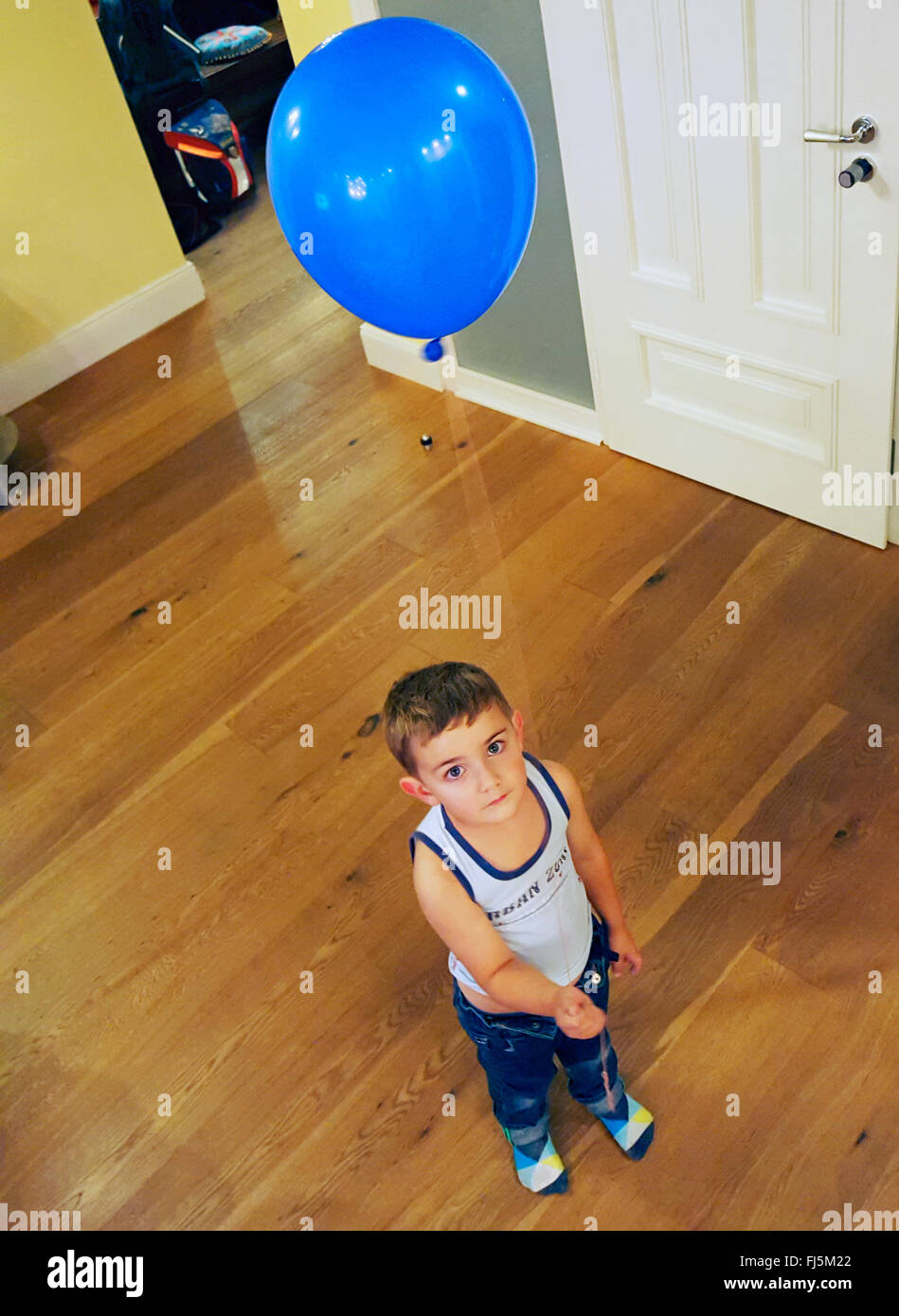 little boy with blue air balloon Stock Photo