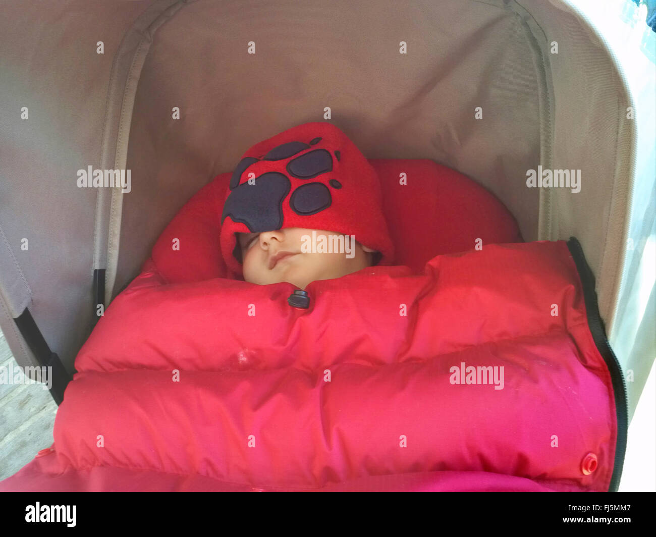 sleeping small child in a buggy Stock Photo