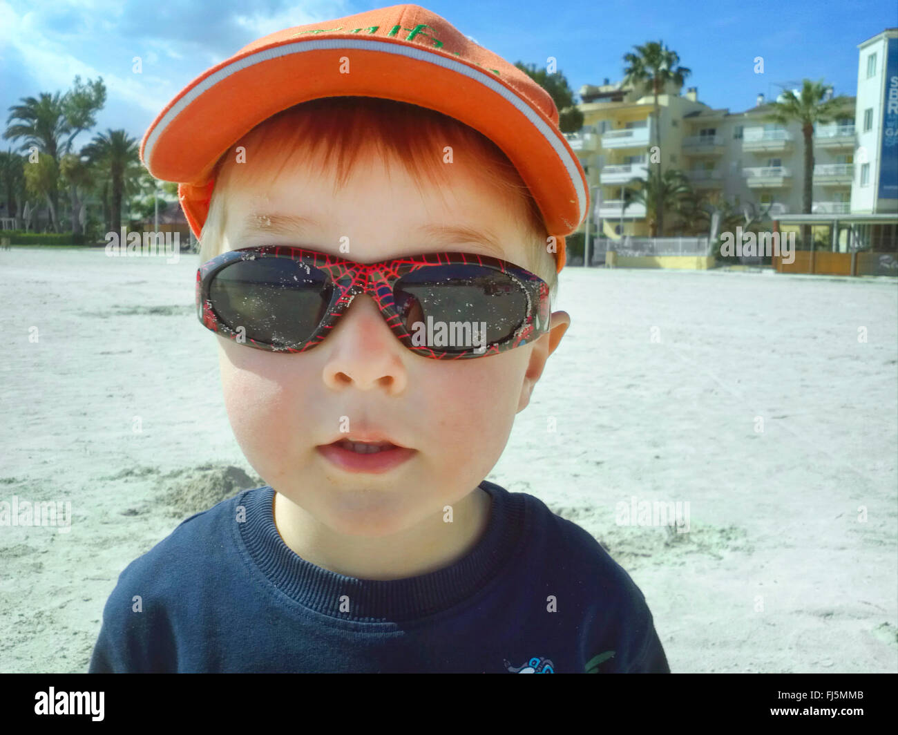 cool little boy with sunglasses and baseball cap, Netherlands Stock Photo