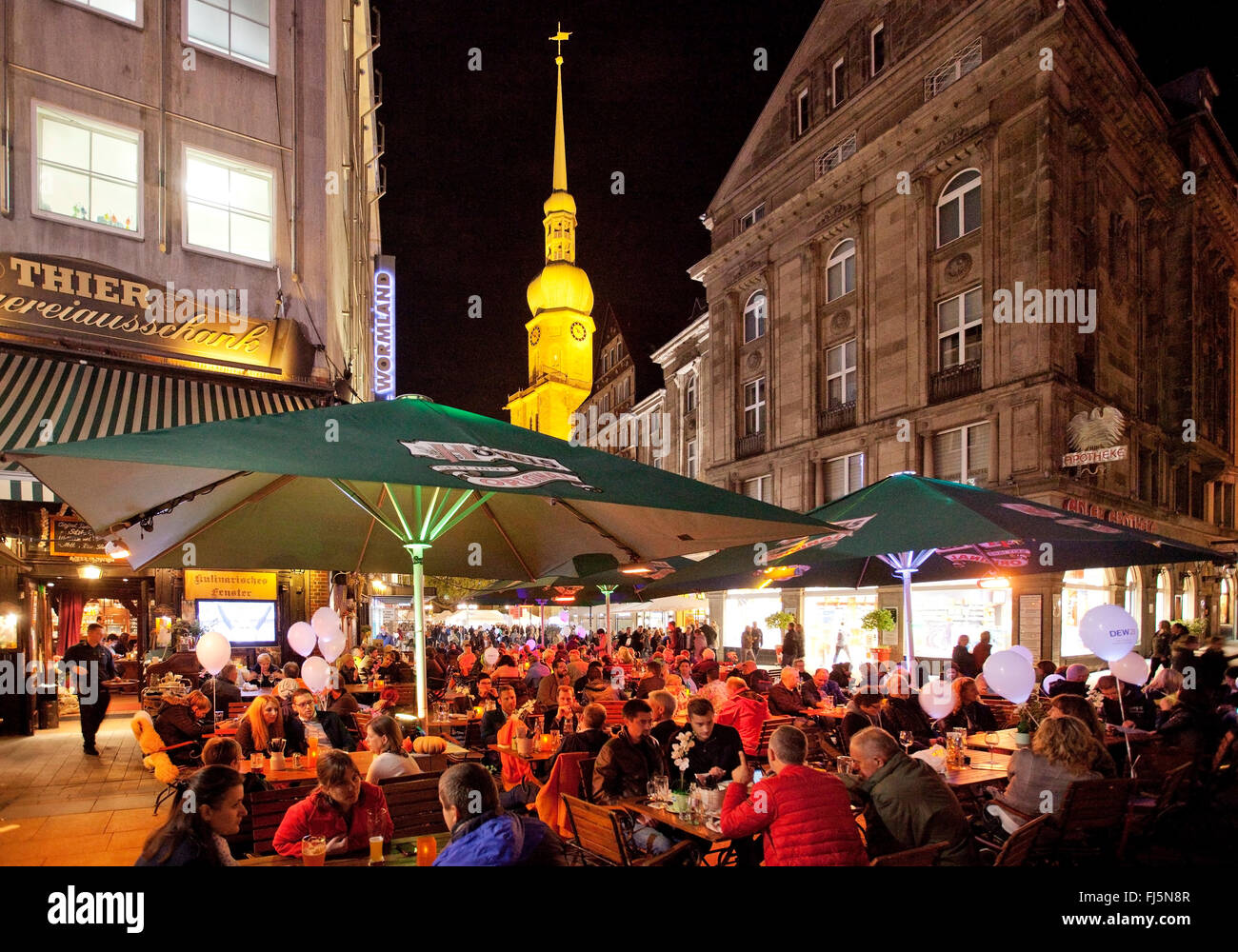 People in a sidewalk restaurant at the old market with Reinoldi church in Dortmund, Germany, North Rhine-Westphalia, Ruhr Area, Dortmund Stock Photo