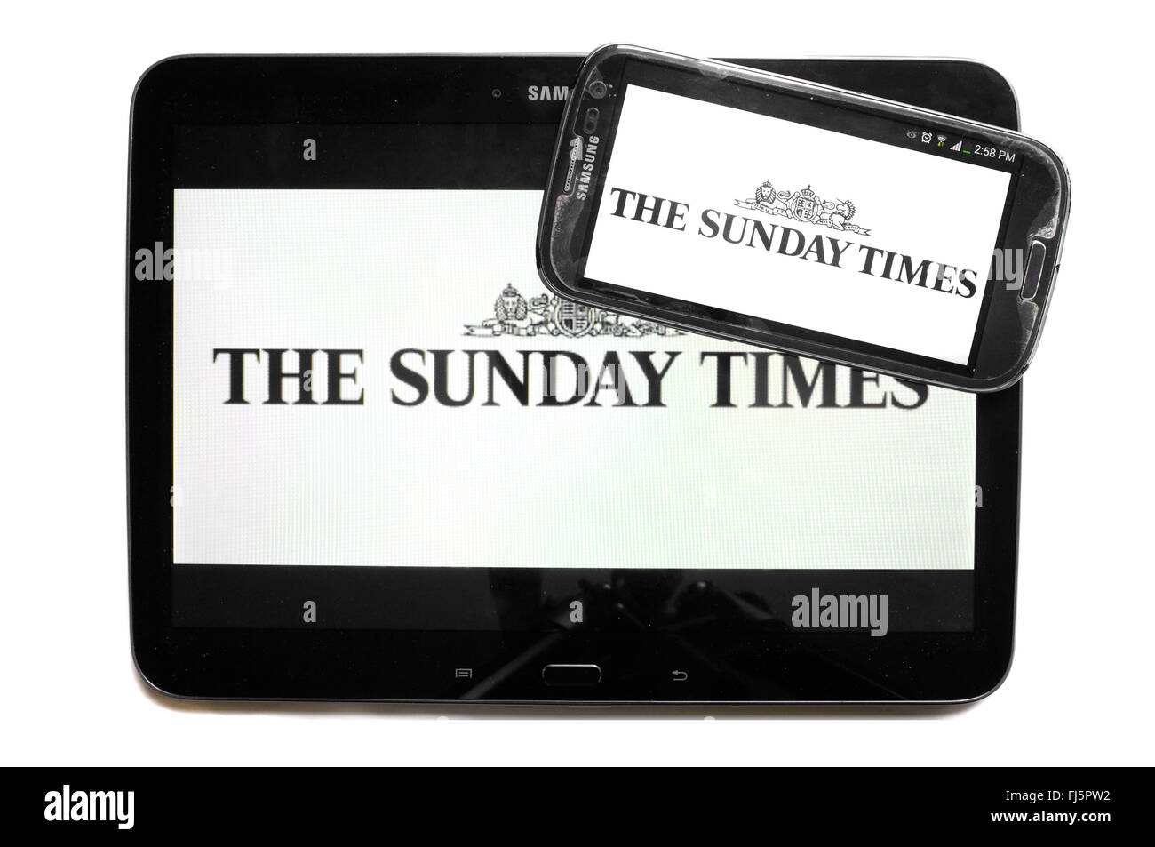The logo of The Sunday Times newspaper displayed on the screens of a tablet and a smartphone. Stock Photo
