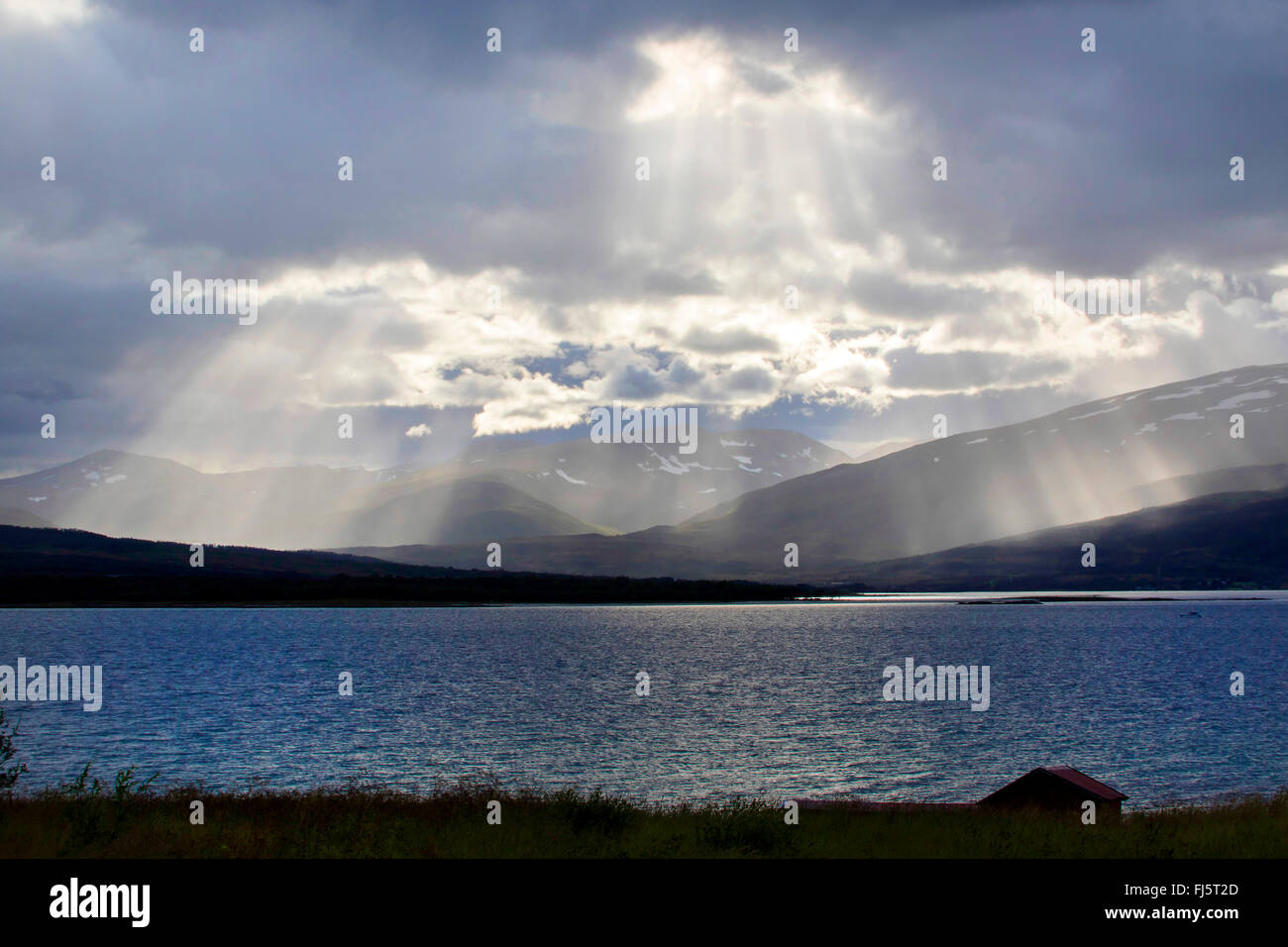 crepuscular rays, Norway, Troms, Tromsoe Stock Photo