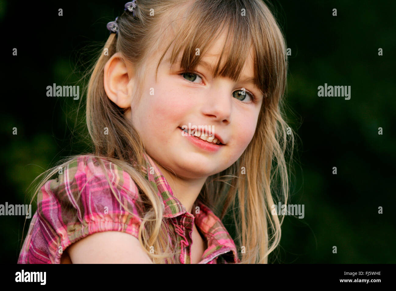 little girl smiling, portrait, Germany Stock Photo