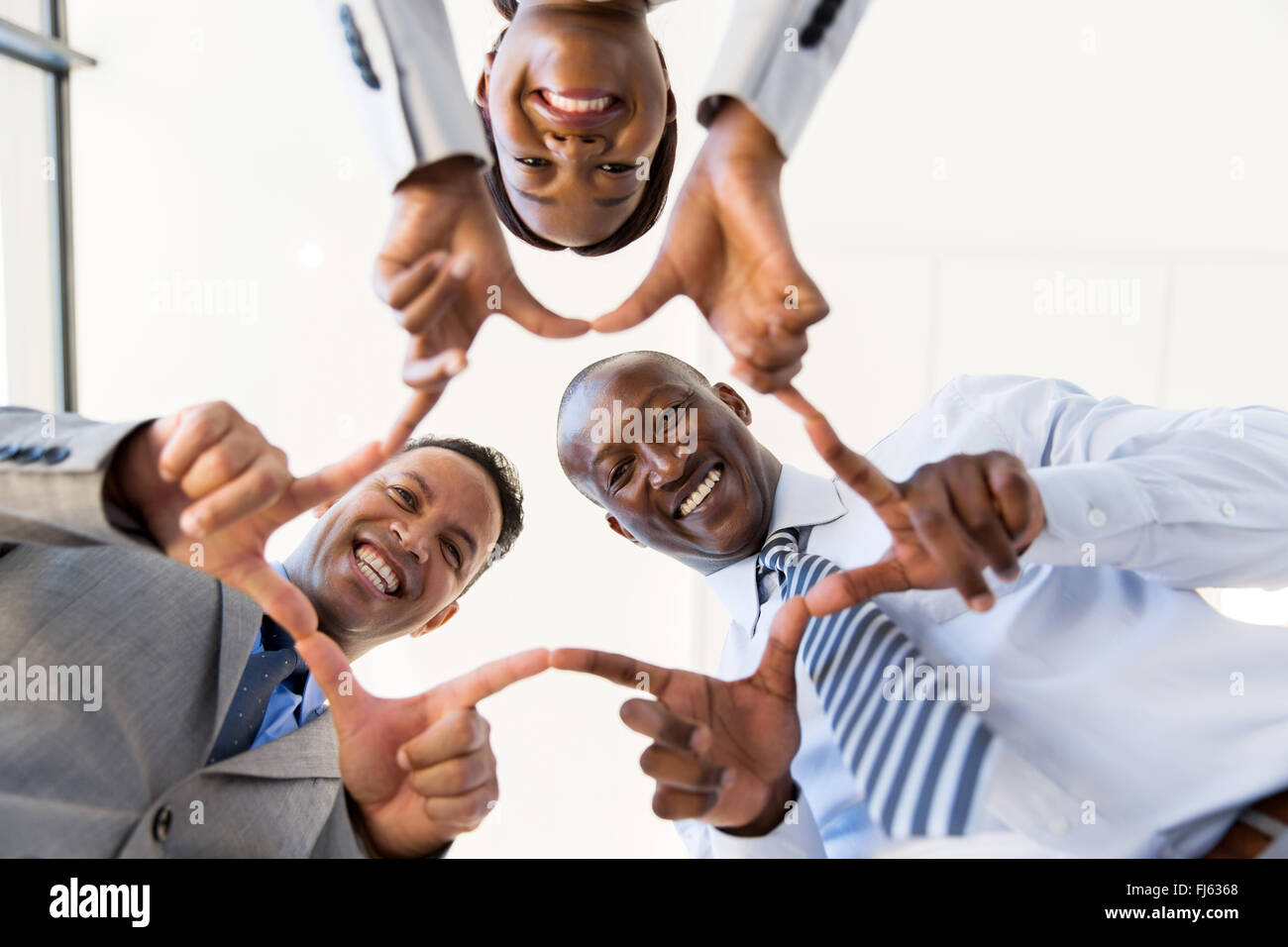 low angle view of business group connecting hands Stock Photo
