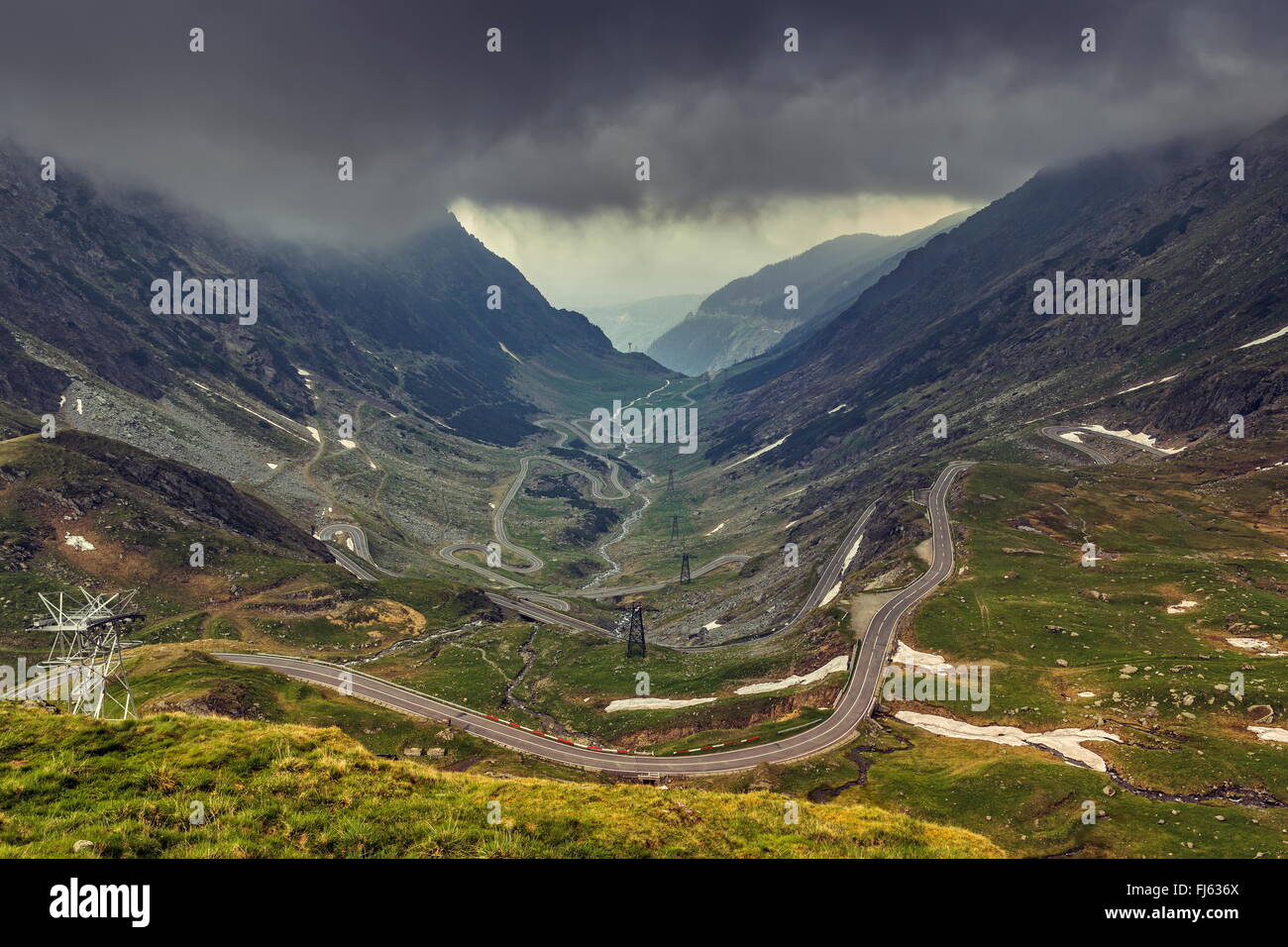Stormy mountain landscape with famous sinuous Transfagarasan road in Fagaras mountains, Romania. Stock Photo