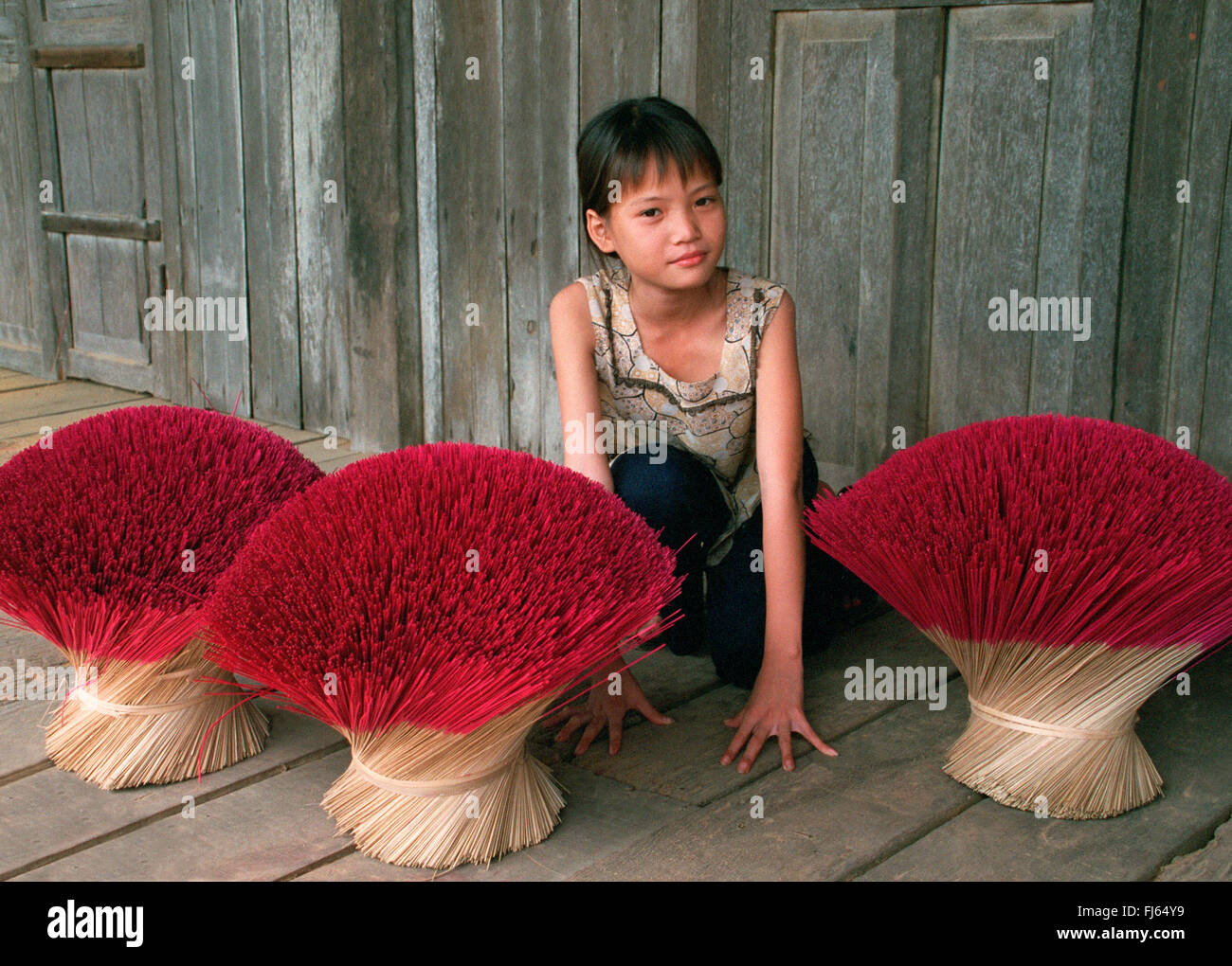 Vietnamese girl selling incense, Vietnam Stock Photo Alamy