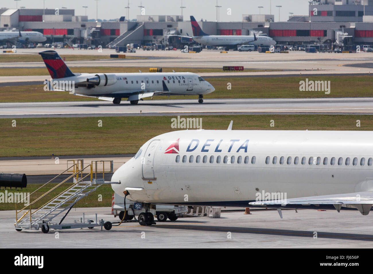 Delta Airline planes taxi on the runway at Hartsfield–Jackson Atlanta International Airport in Atlanta, Georgia. Stock Photo