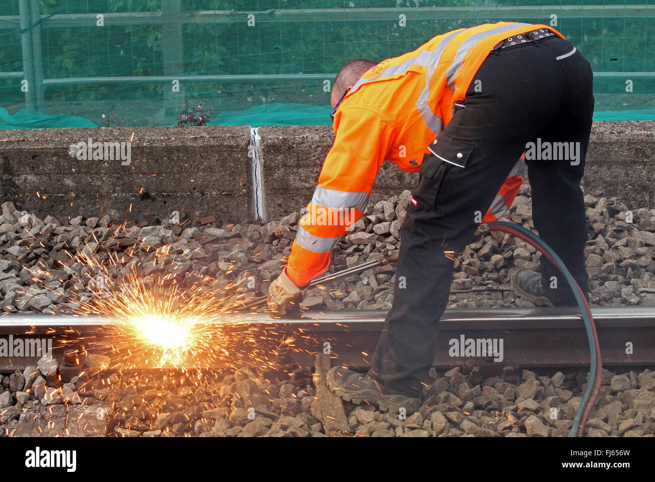 railway worker cutting railroad tracks with a blowpipe, Germany Stock Photo