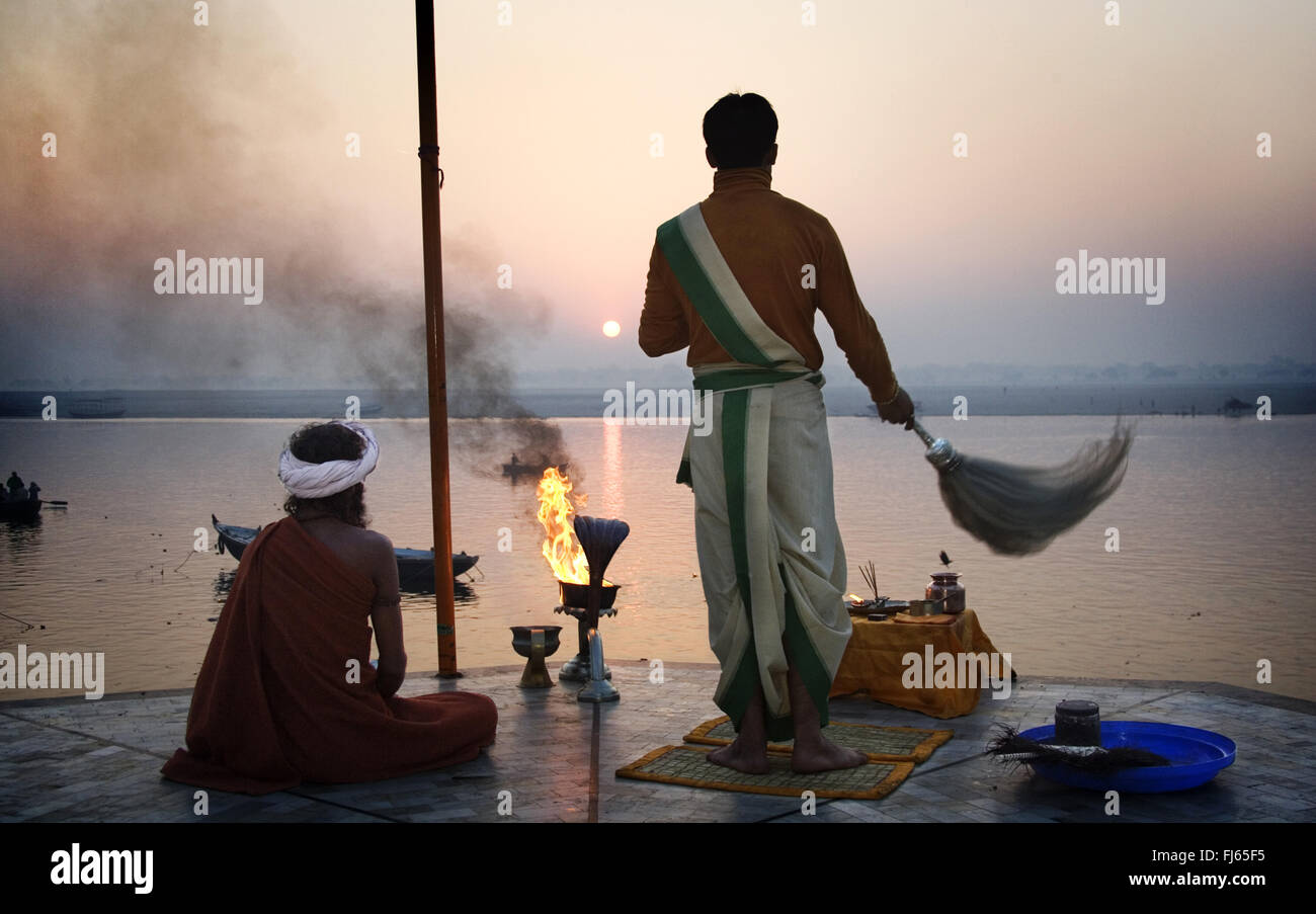 Hindus greeting the sun over Ganges River, India, Varanasi Stock Photo