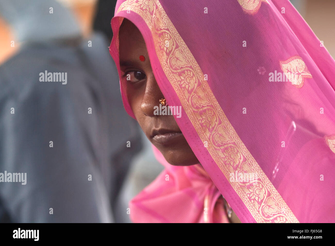 woman behind a pink veil, India, Delhi Stock Photo