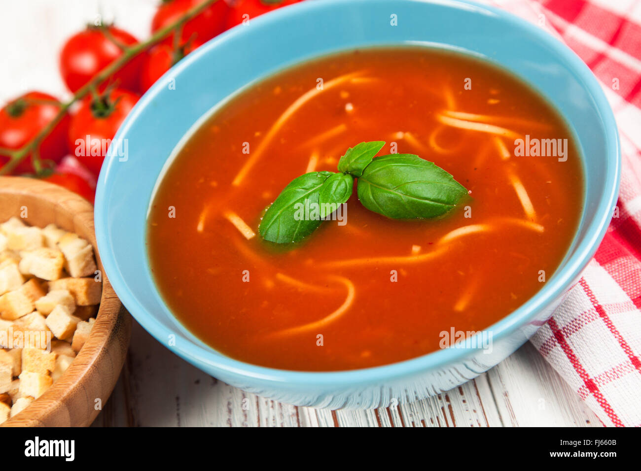Tomato soup and basil Stock Photo