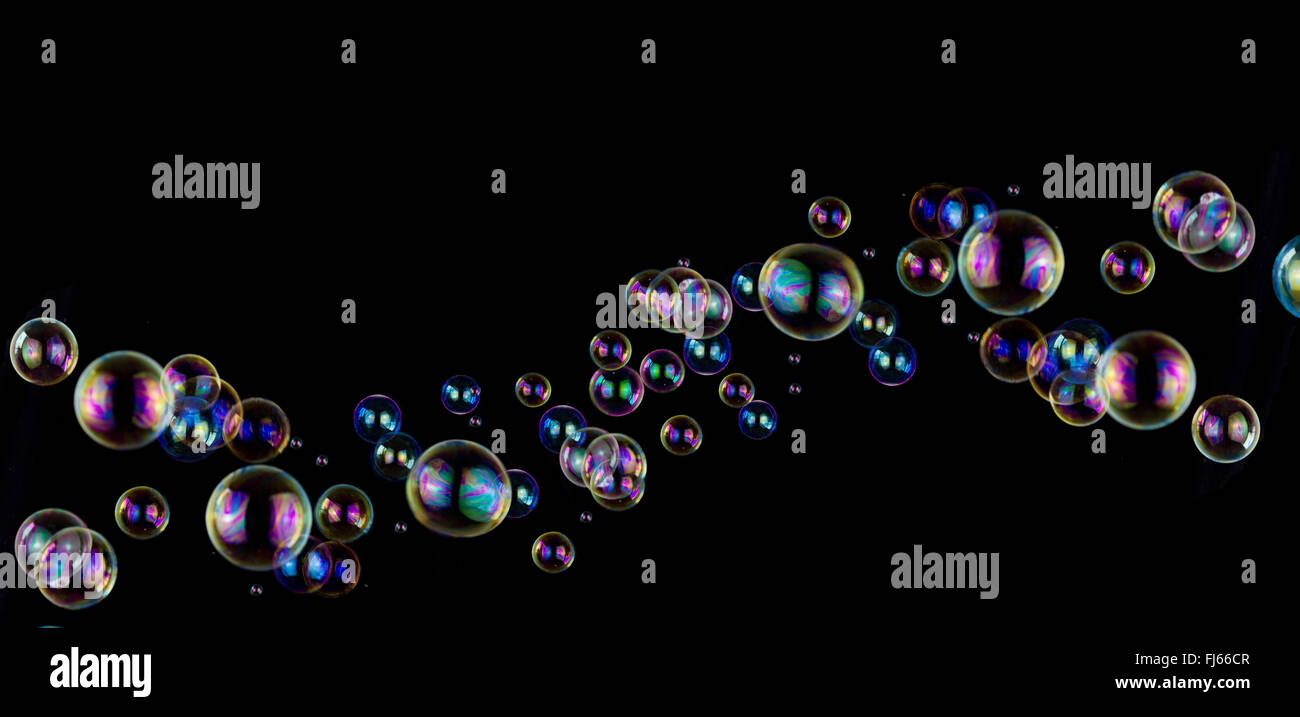 colorful soap bubble wave on black background Stock Photo