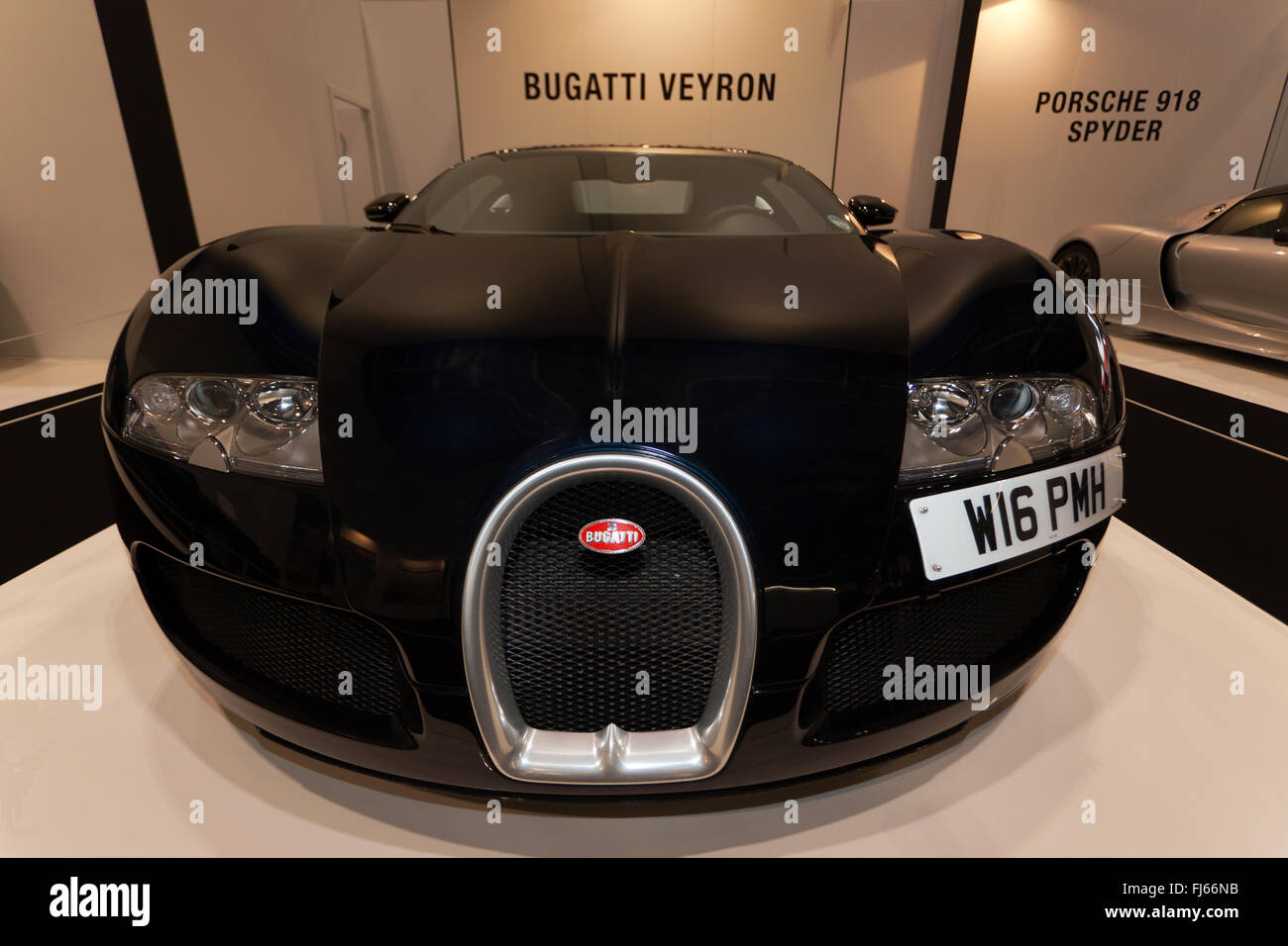 Wide-angle, front view of a Bugatti Veyron, in the 'Evolution of the Supercar' section of the 2016 London Classic Car Show. Stock Photo