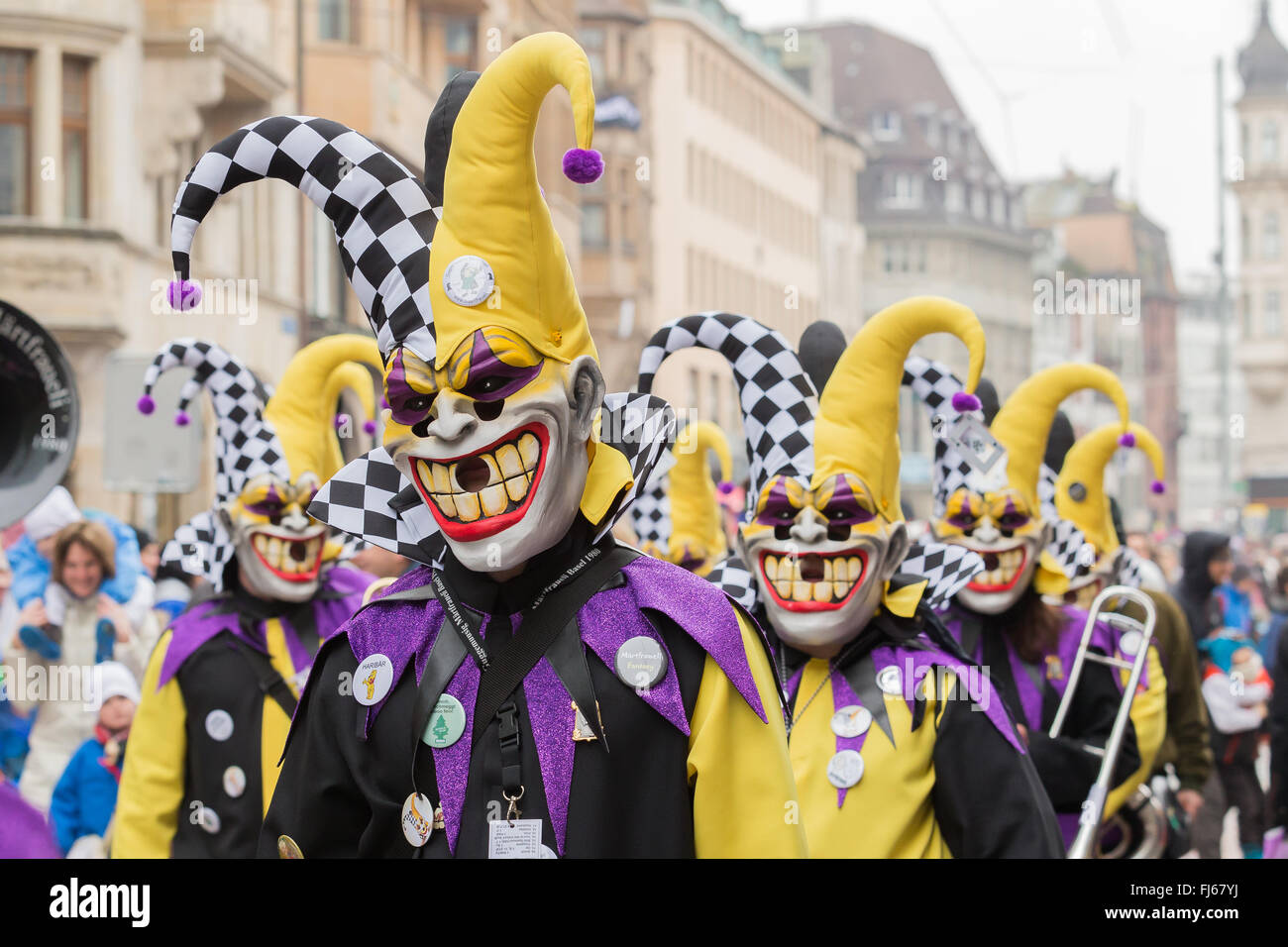 The parade of the Basel Carnival in Switzerland, with clowns, colorful  costumes that throw confetti on the spectators. It is a traditional  carnival Stock Photo - Alamy