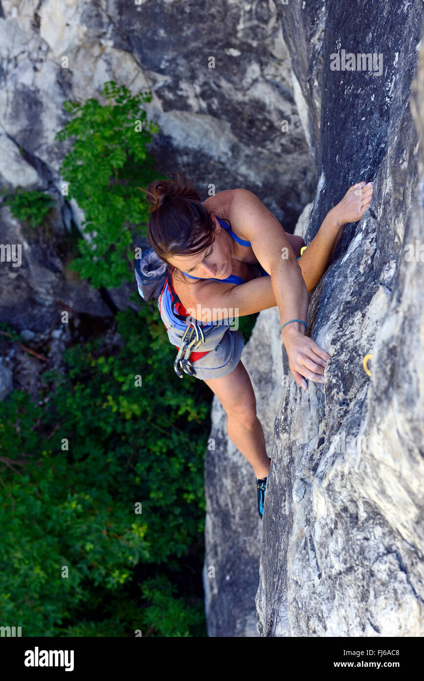 woman climbing the rocks, France, Savoie Stock Photo