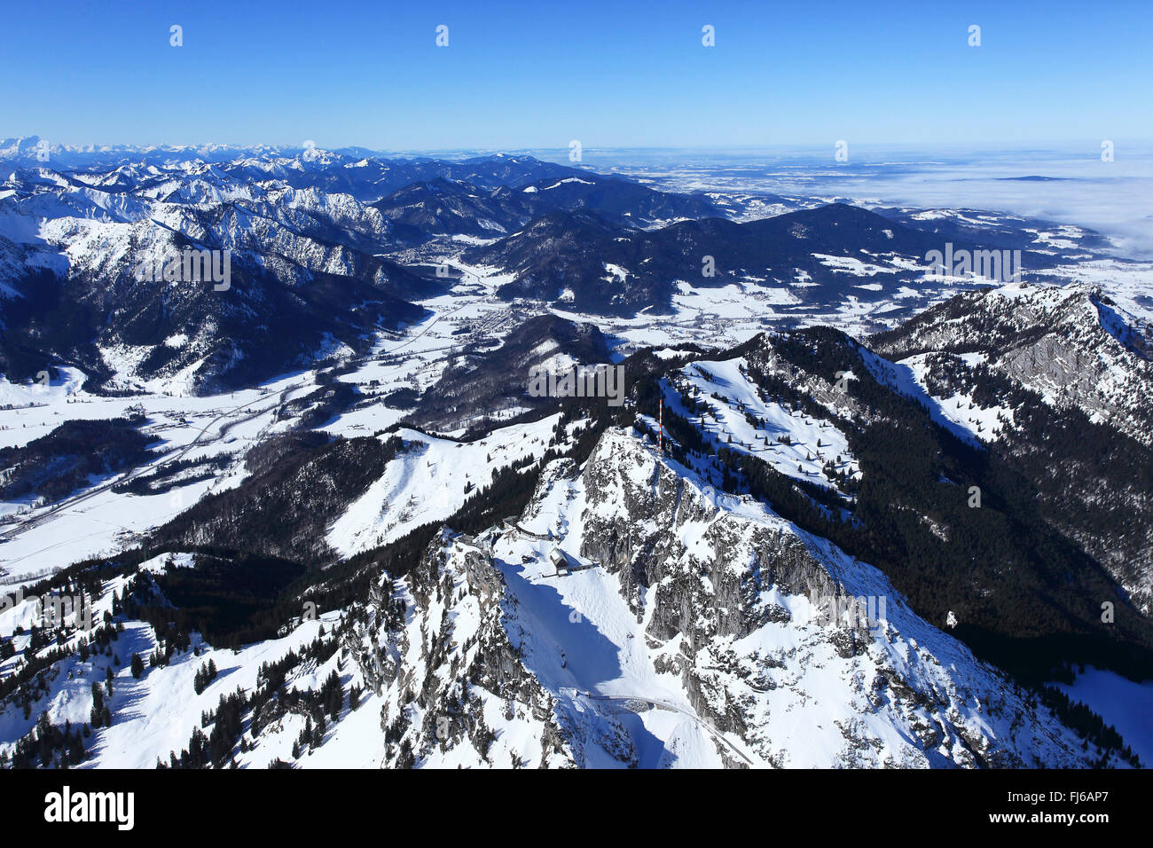 Wendelstein mountain in winter, fog in lowlands, aerial view, Germany, Bavaria Stock Photo