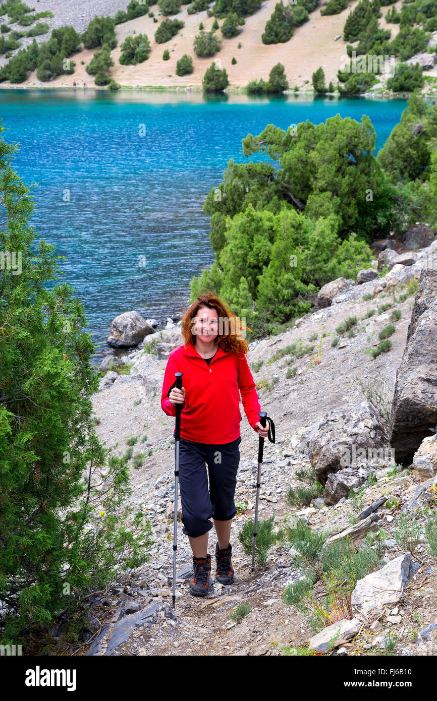 Female Hiker and Mountain Lake Stock Photo