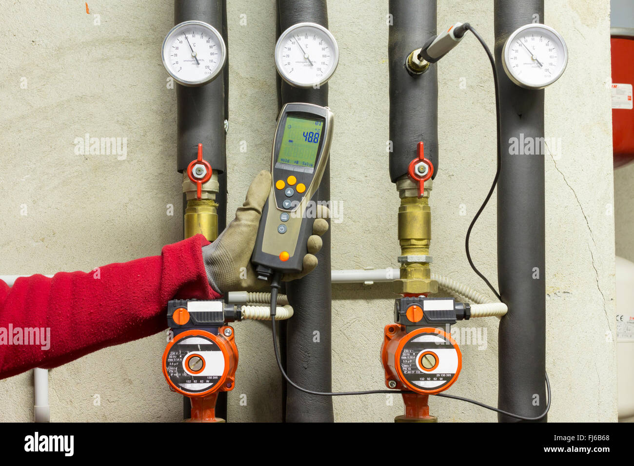 Hydraulic working measures the temperature in a thermal power Stock Photo Alamy