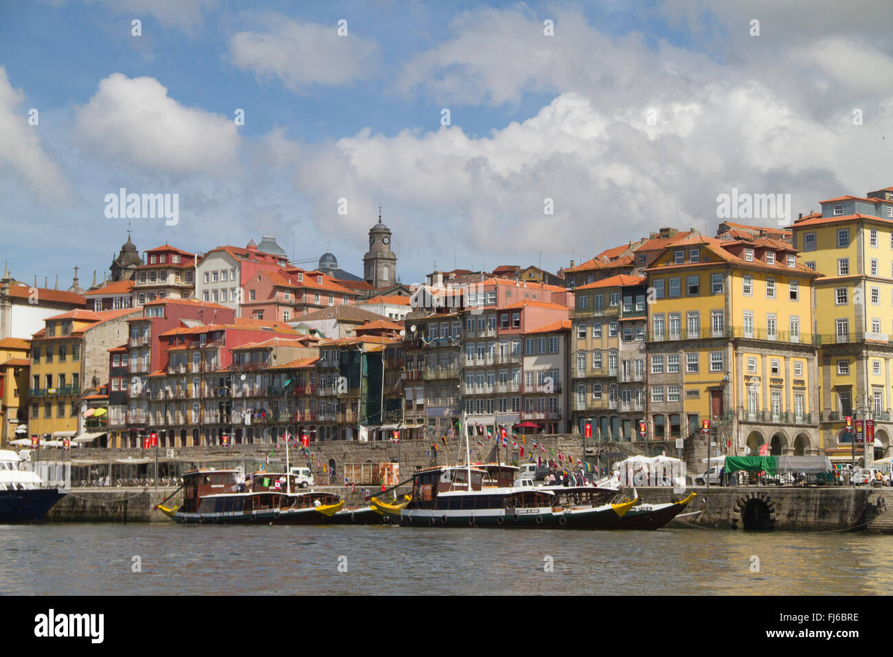 Ribeira district seen from the Duoro River with tourist excursion boats Oporto,Portugal Stock Photo
