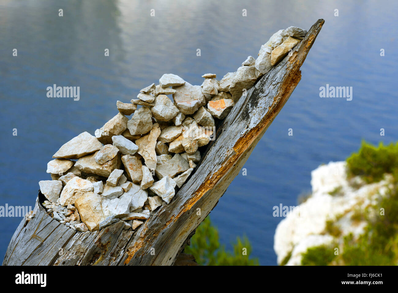stones on tree stump, France, Calanques National Park, Marseilles Stock Photo