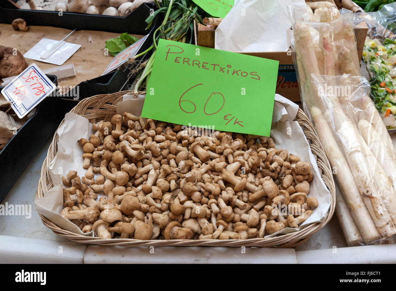 Famous Perretxikos, Calocybe gambosa Tricholoma georgii, in the Pamplona market, Navarra, Spain Stock Photo
