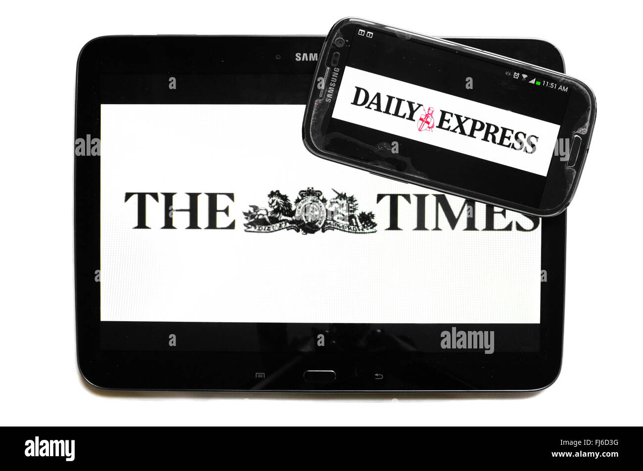 The logos of The Times and the Daily Express newspapers displayed on the screens of a tablet and a smartphone. Stock Photo