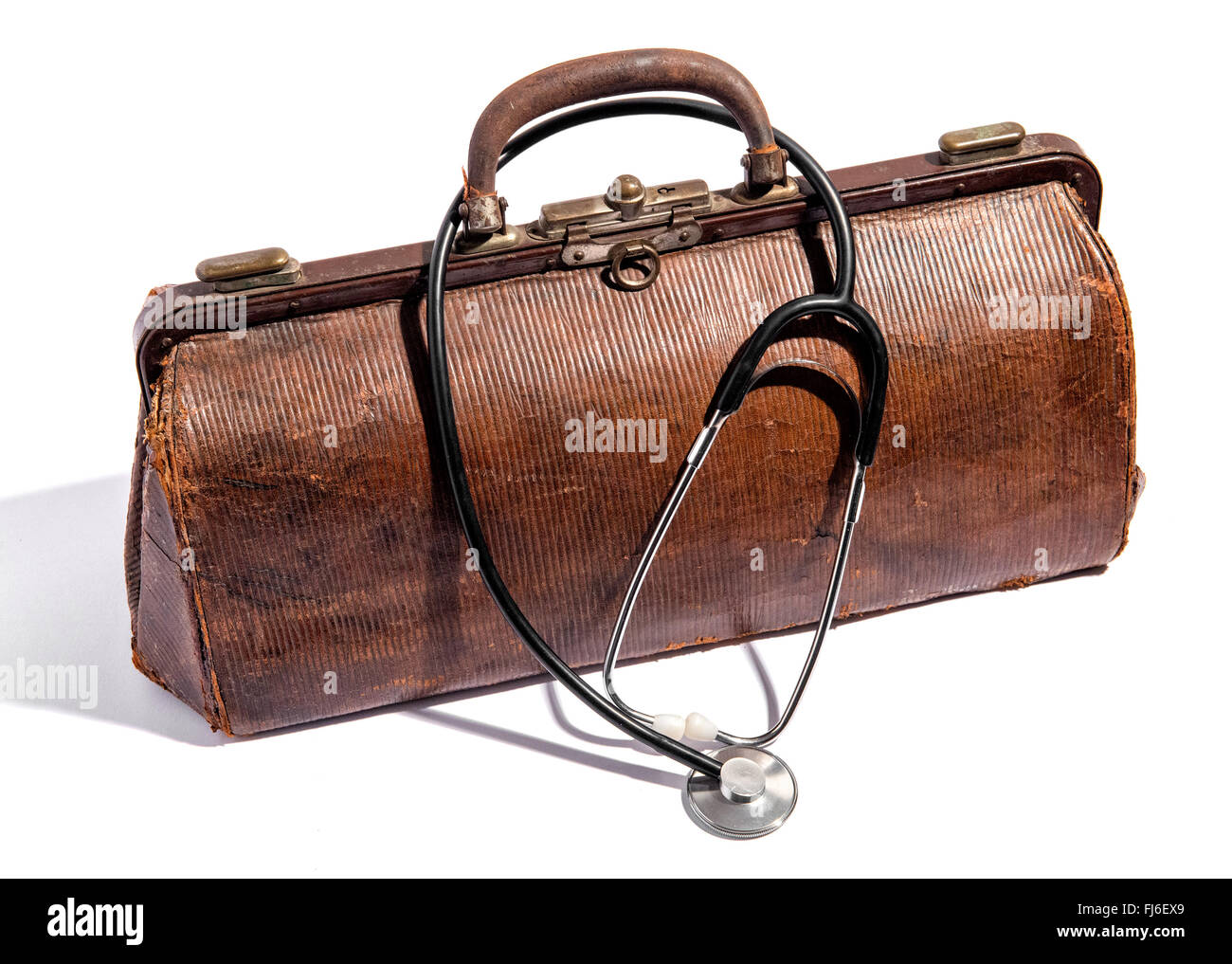 Old closed battered brown leather doctors bag for instruments and equipment Stock Photo