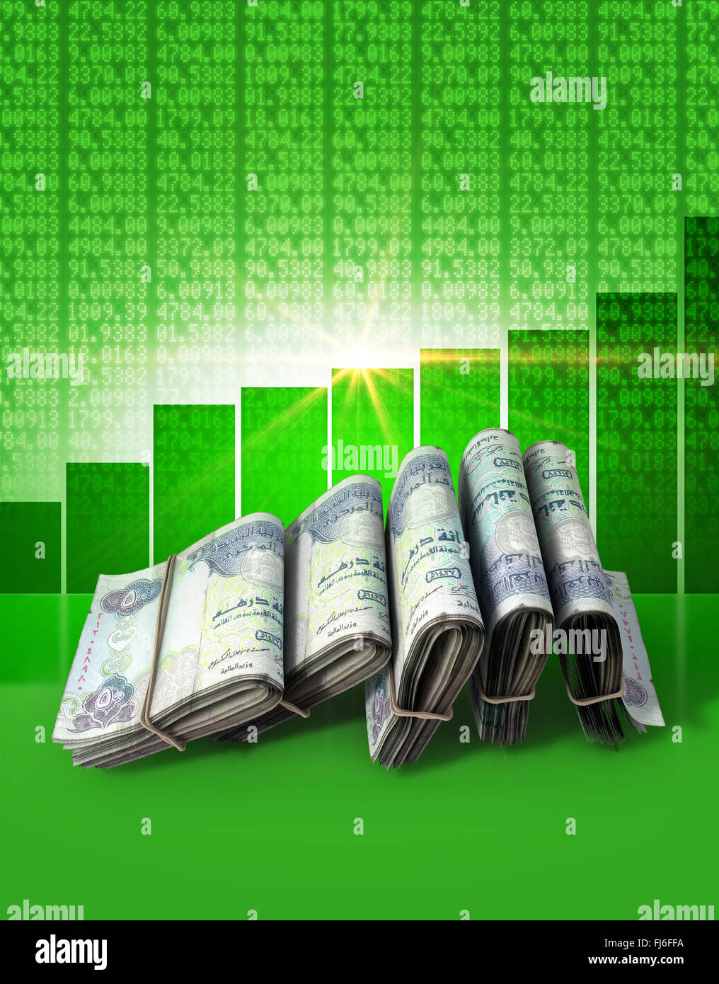 Wads of folded stacks of dirham banknotes on a green digital stock
