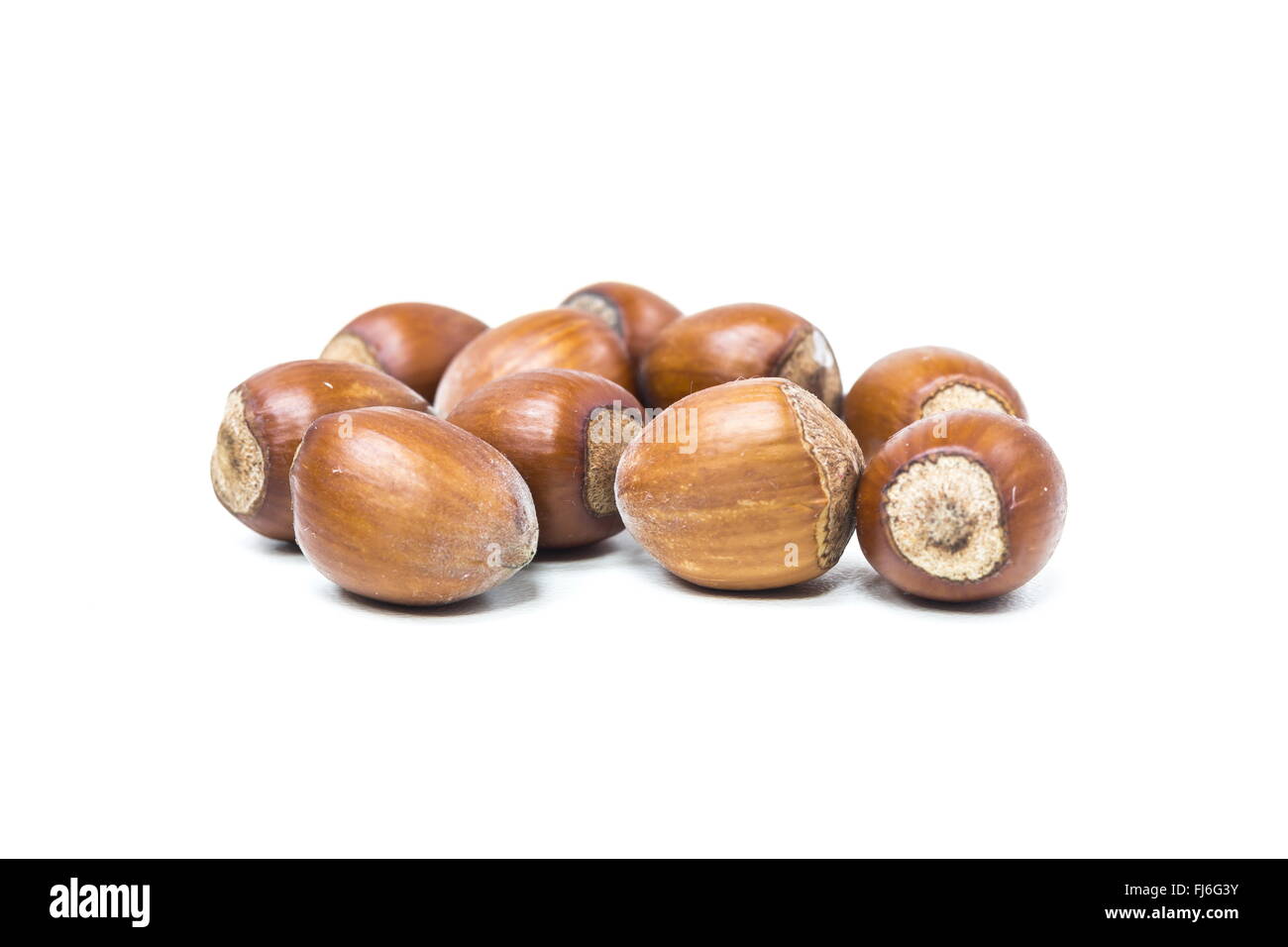 Hazelnuts on white Stock Photo - Alamy