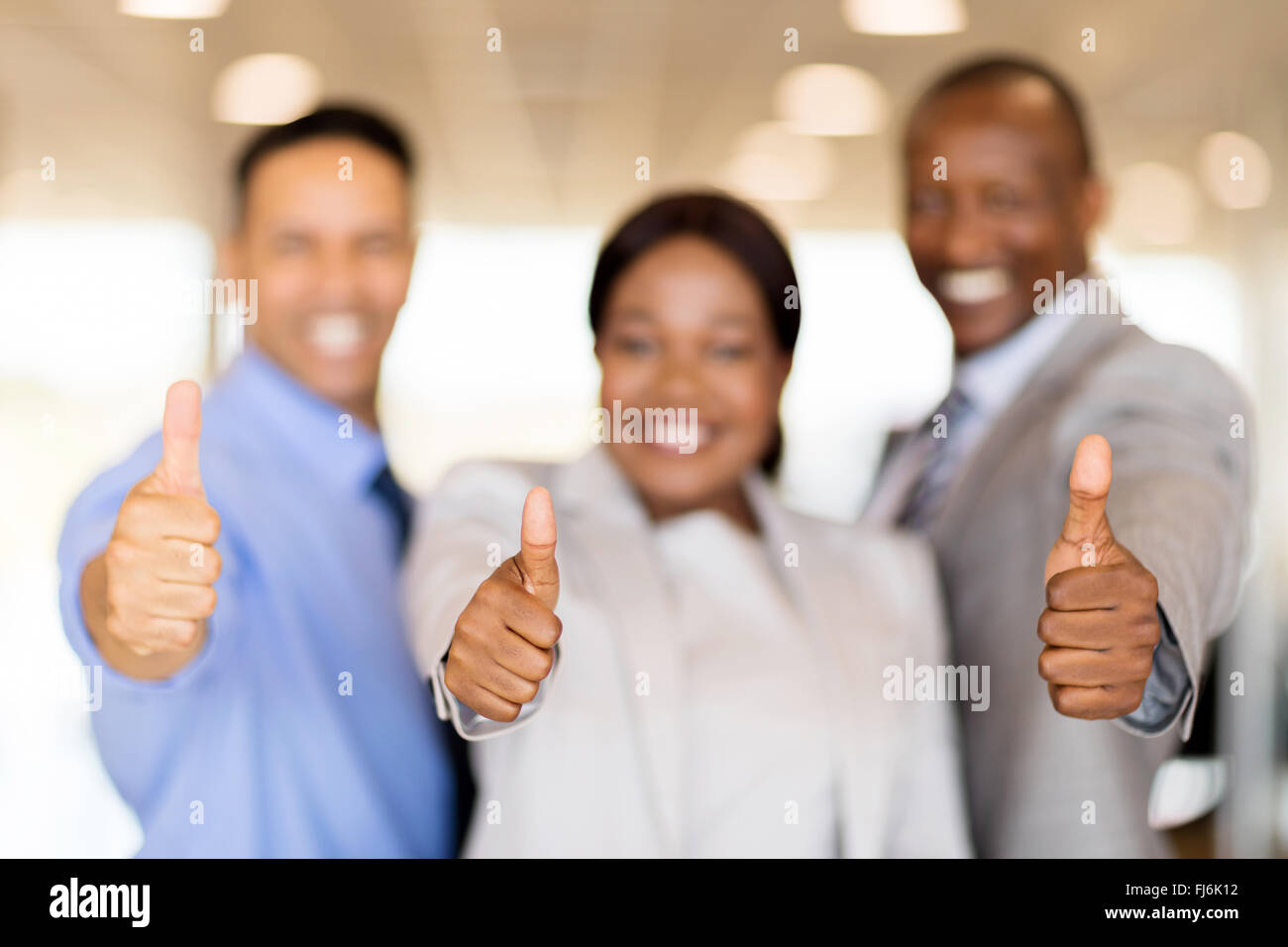 closeup portrait of business team giving thumbs up Stock Photo