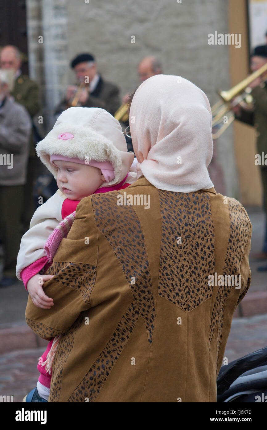 Mother holding baby on Raekoja plats, Tallinn, Estonia Stock Photo