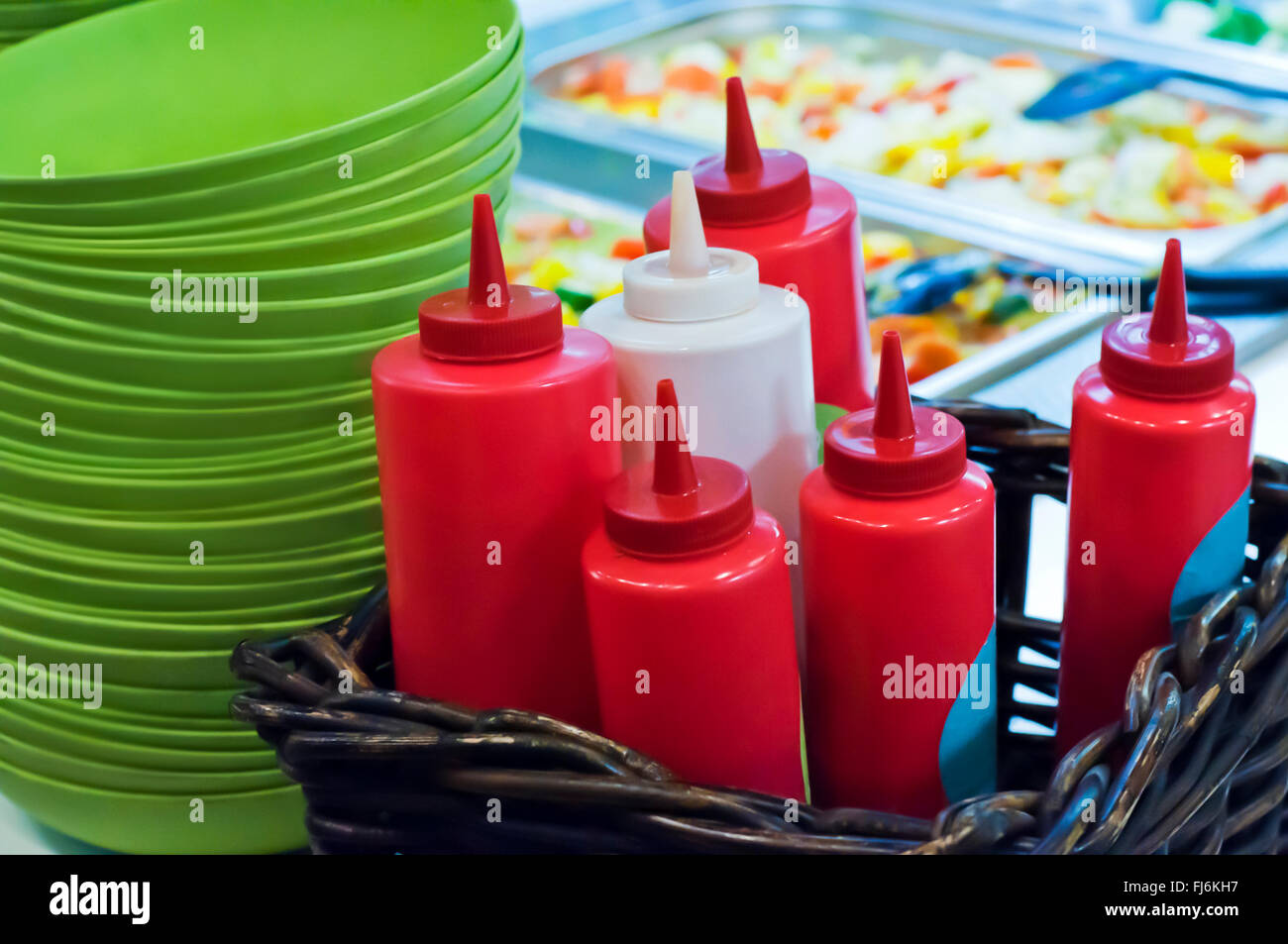 Bottles of ketchup and sauce on a distriburion line of restaurant