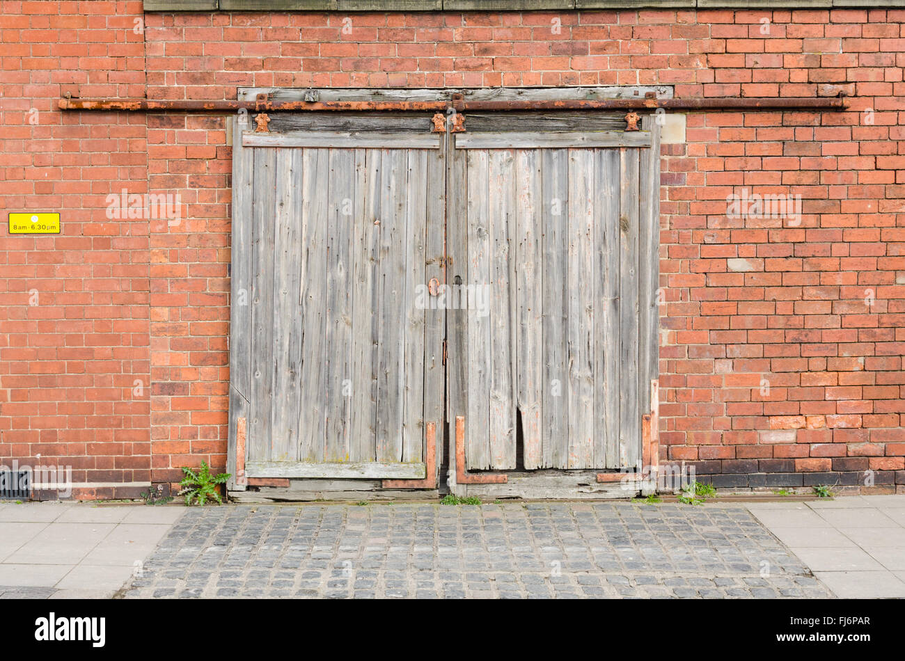 Old wooden sliding garage doors Stock Photo Alamy