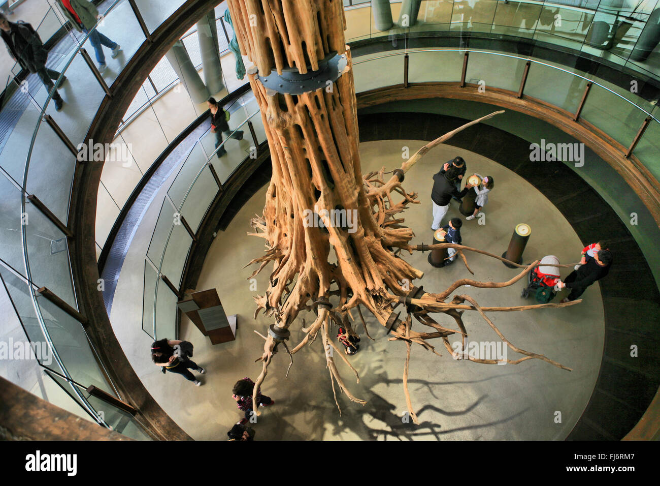 BARCELONA, SPAIN - APRIL 3: People observing the almost infinite ascending helix around a giant tree at Cosmocaixa Museum, Barce Stock Photo
