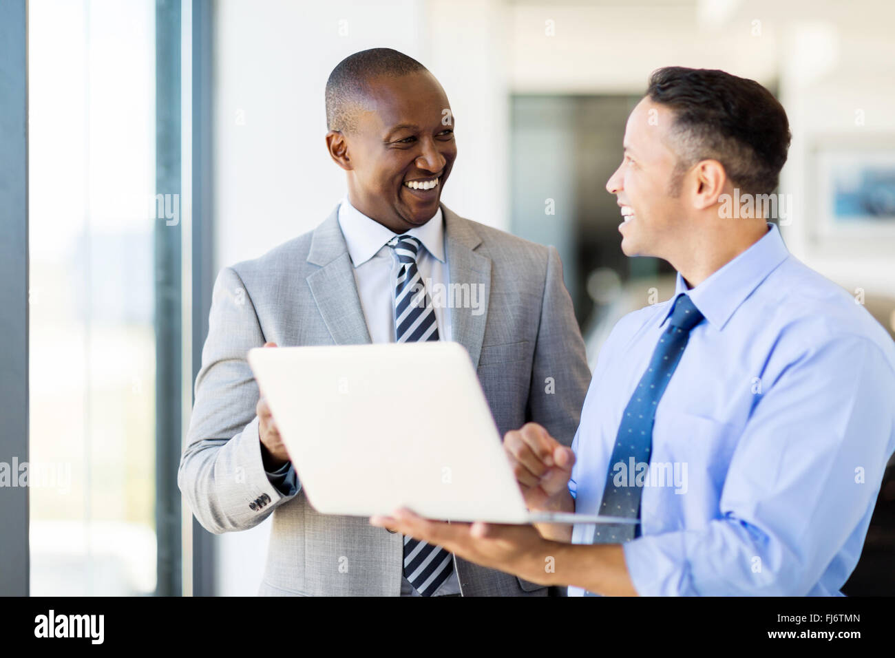 multiracial business people using laptop in modern office Stock Photo