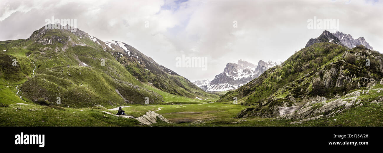 A lonely figure in an Alps Valley Stock Photo