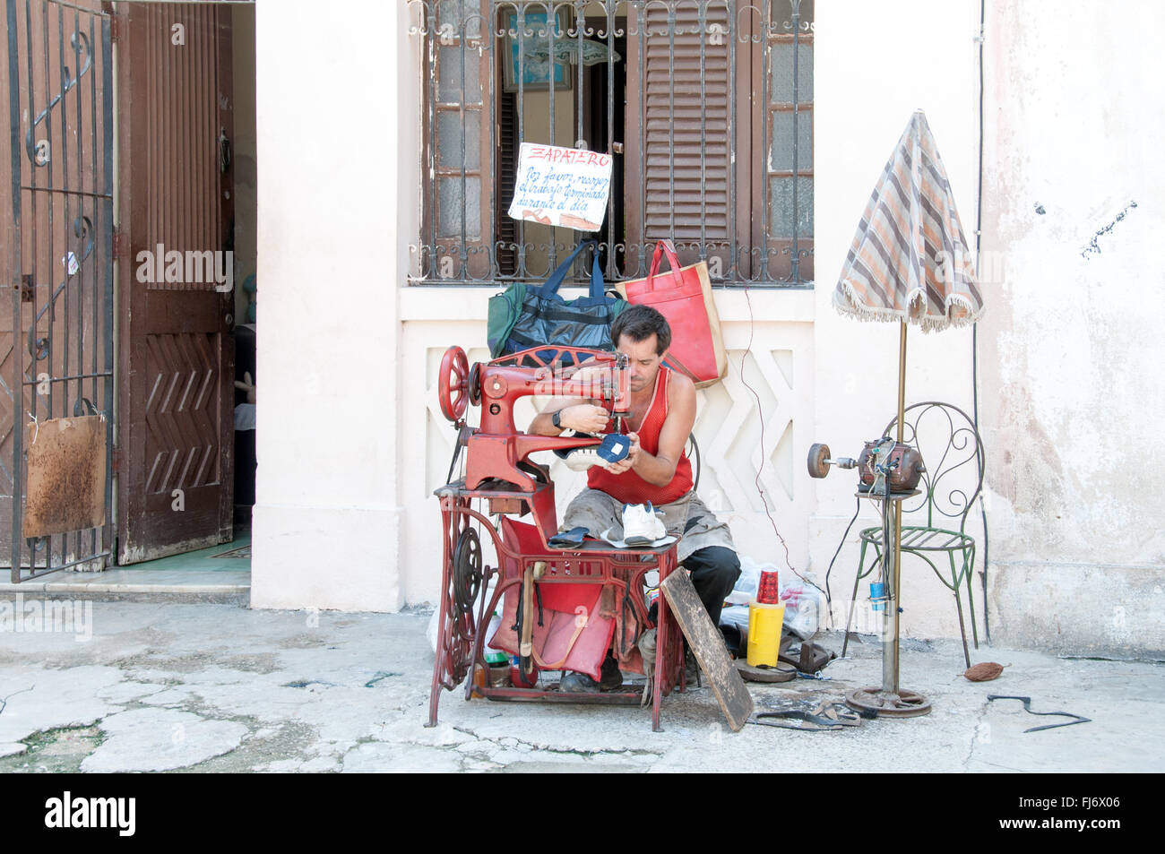 Shoemaker in the street at Havana, Cuba Stock Photo Alamy