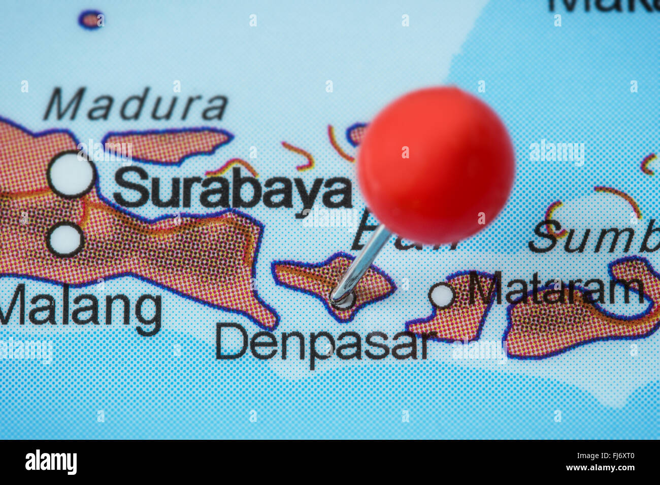 Close-up of a red pushpin in a map of Denpasar, Bali, Indonesia. Stock Photo