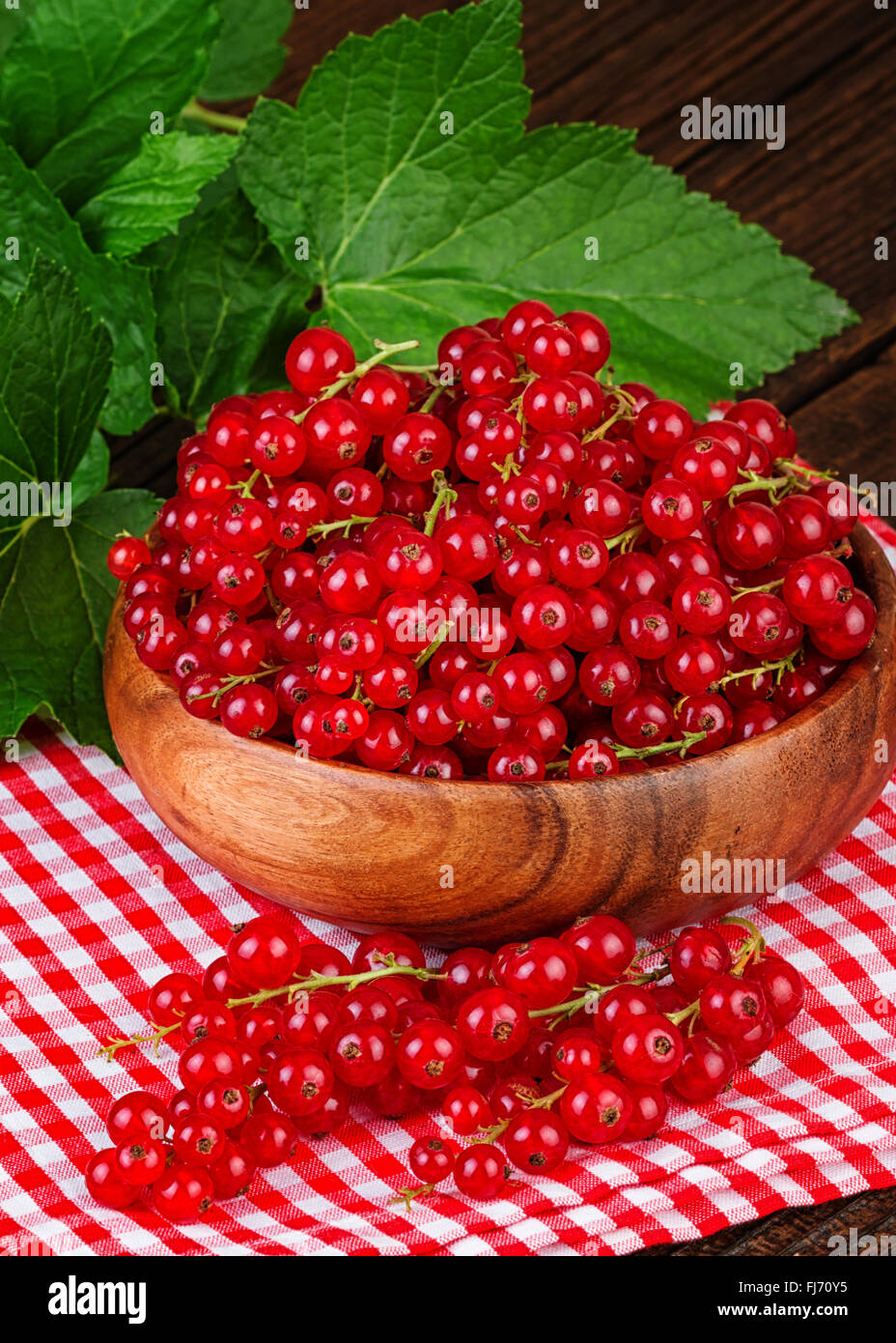 Redcurrant berries rustic background Stock Photo