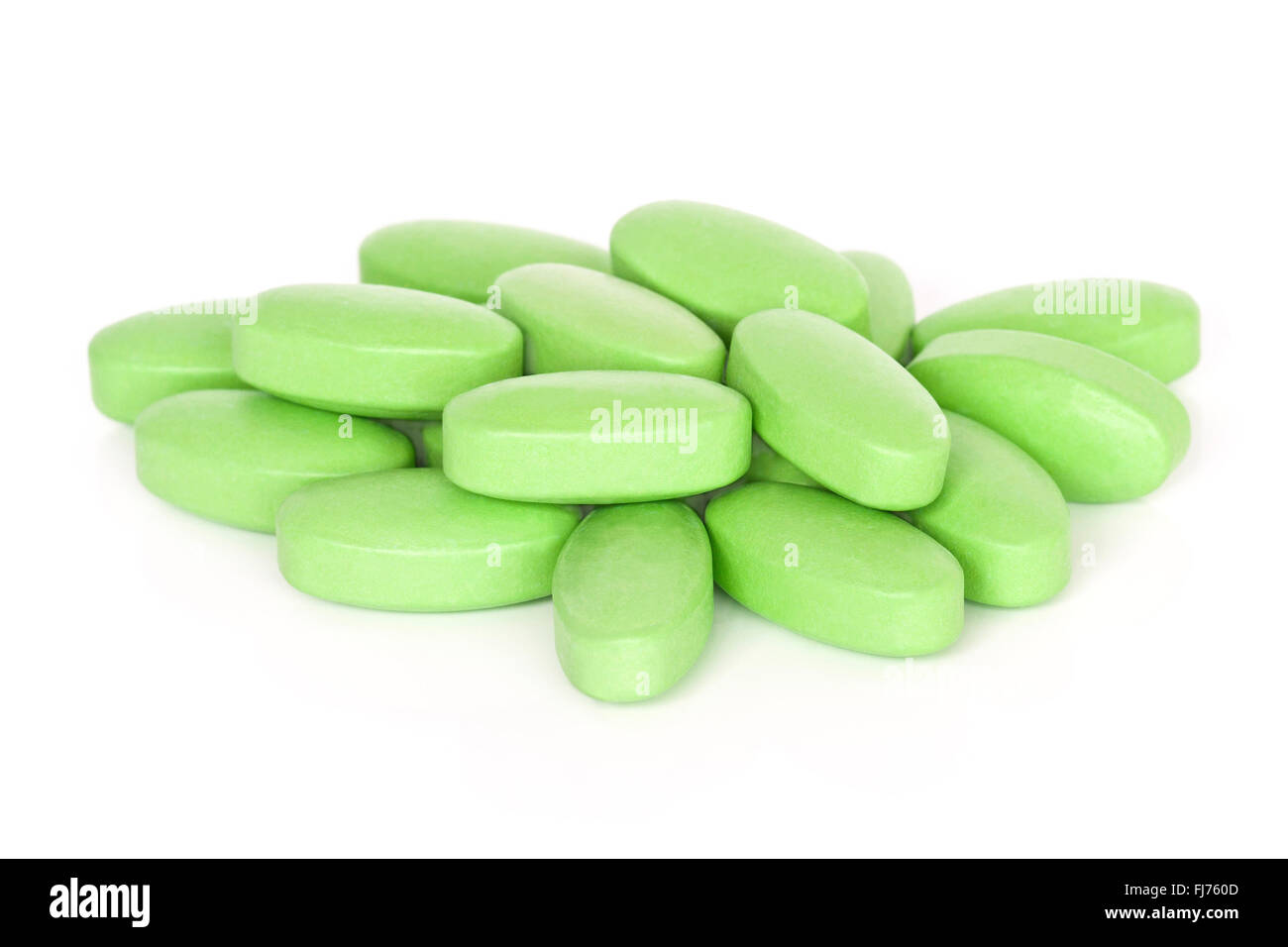 A pile of vitamin B supplement tablets isolated on a white background. Stock Photo